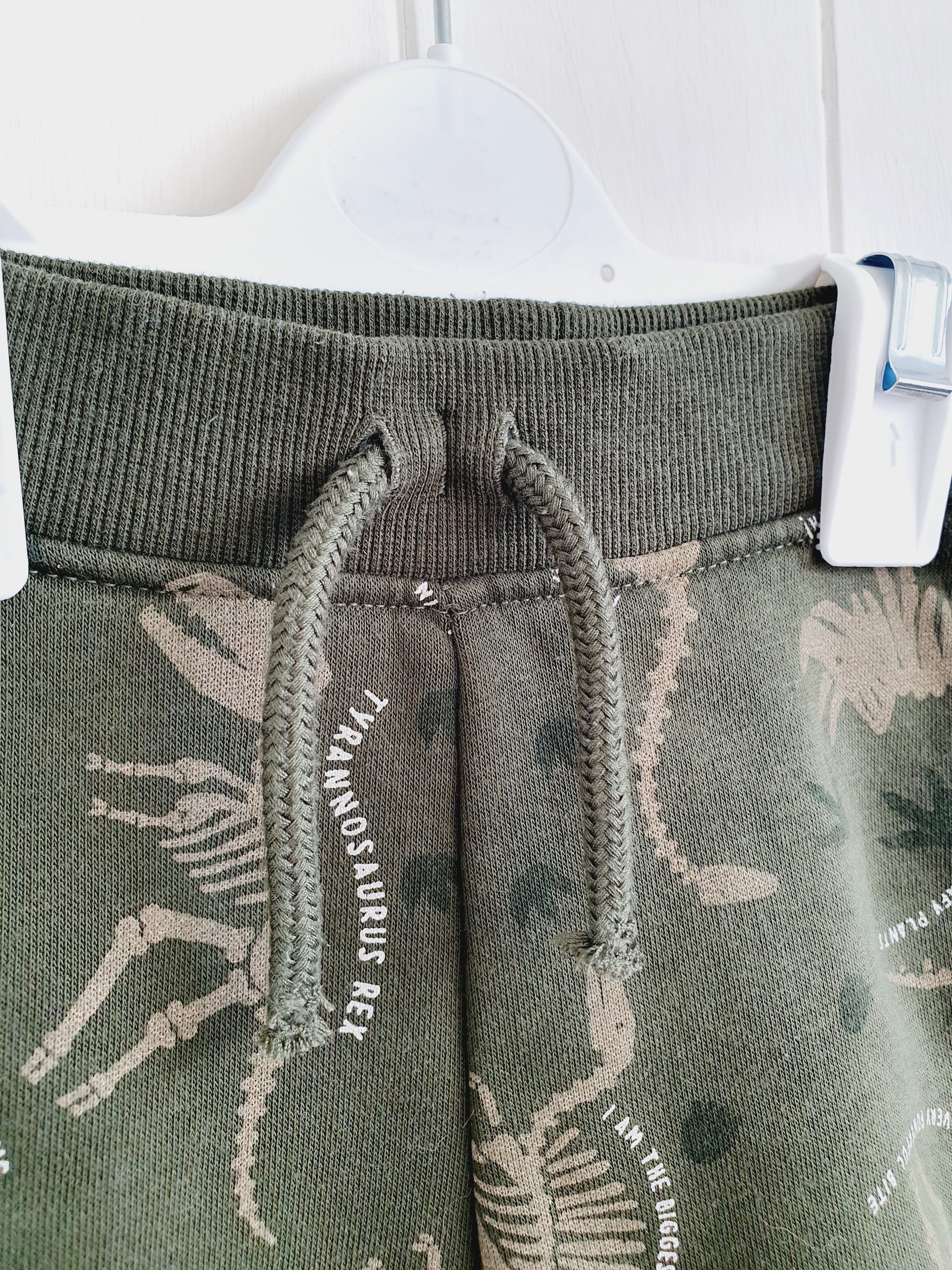 Primark khaki dinosaur skeleton joggers 0-3 months