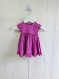 Nutmeg - Newborn girl pink sleeveless frill dress