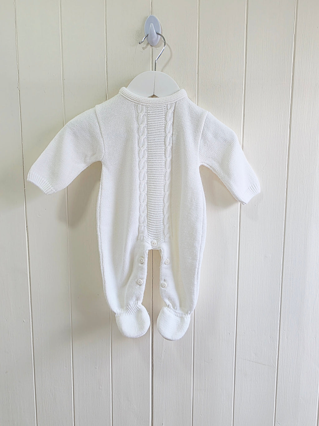 Dandelion - knitted baby romper in white featuring a traditional cable knit design Newborn