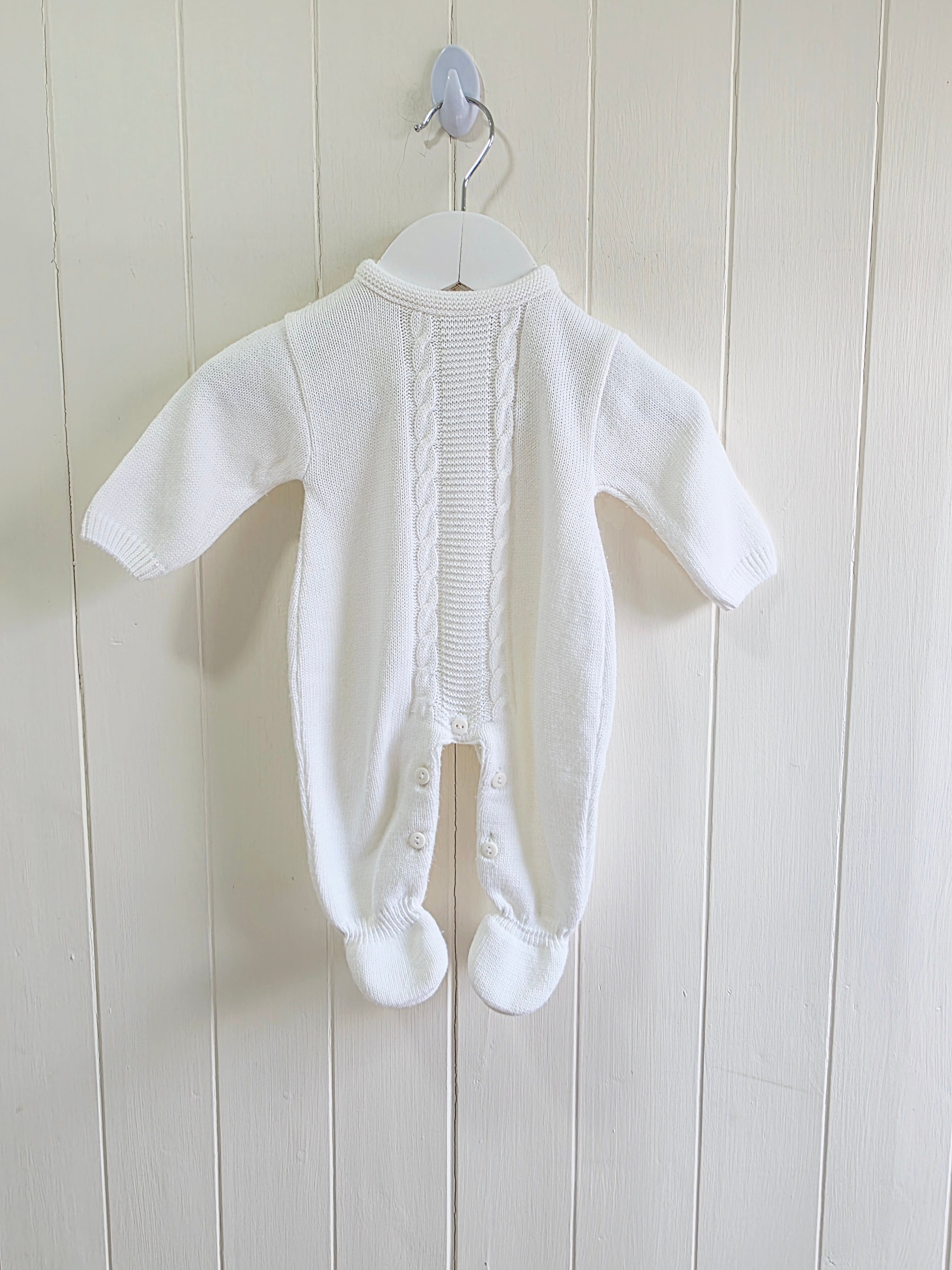 Dandelion - knitted baby romper in white featuring a traditional cable knit design Newborn