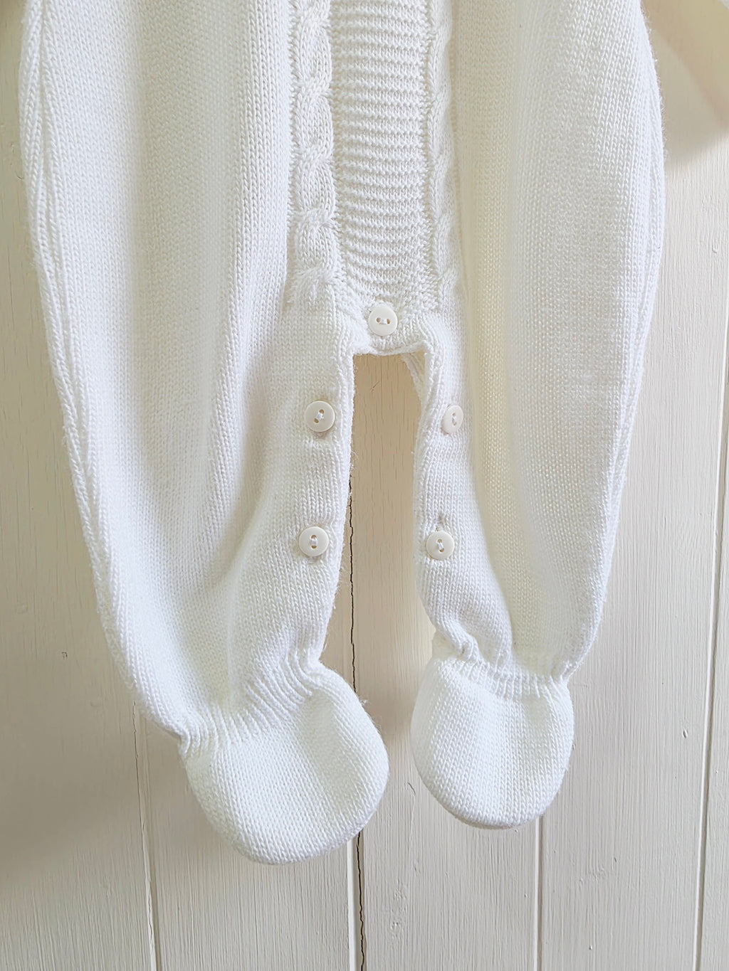 Dandelion - knitted baby romper in white featuring a traditional cable knit design Newborn