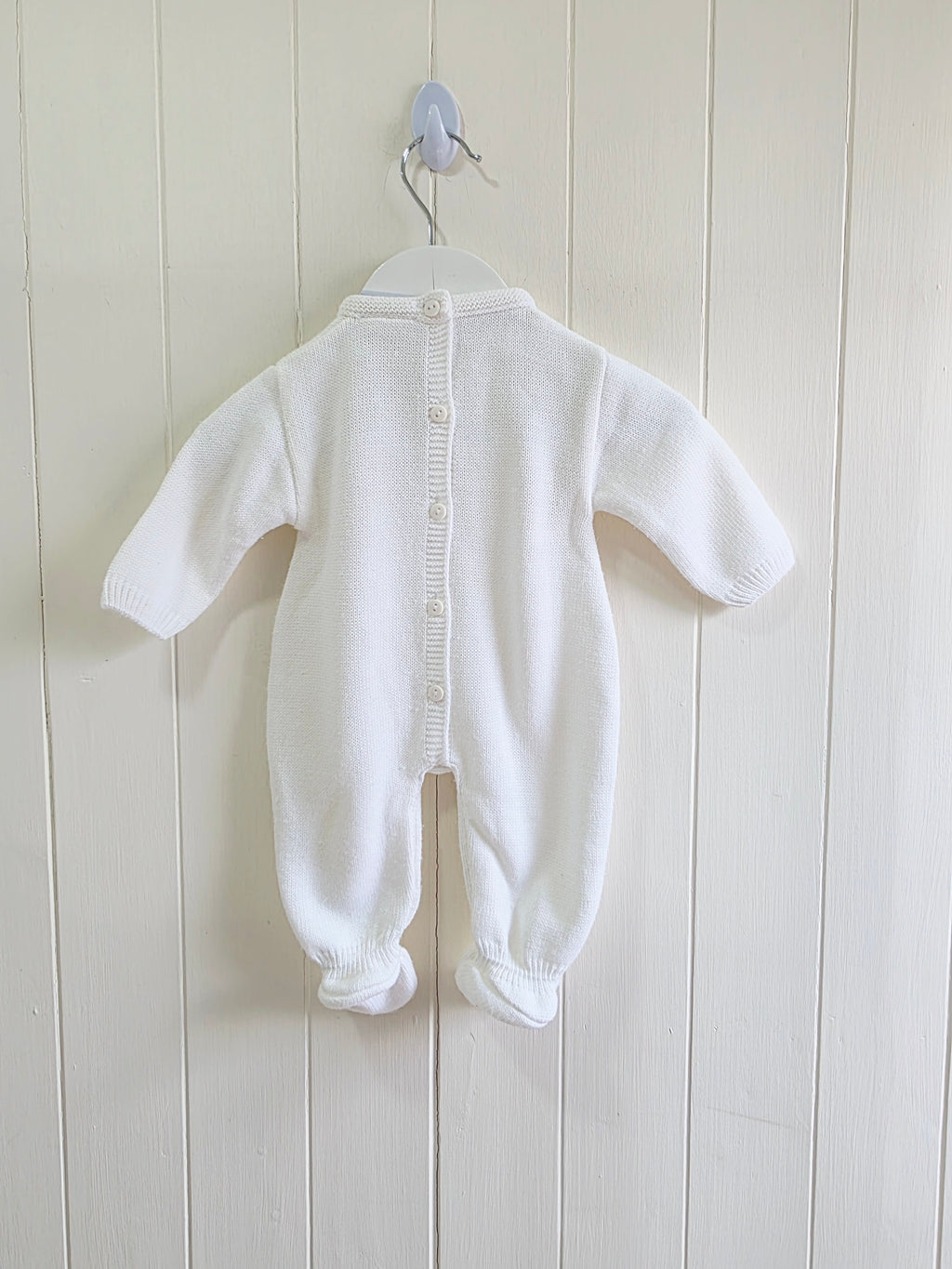 Dandelion - knitted baby romper in white featuring a traditional cable knit design Newborn