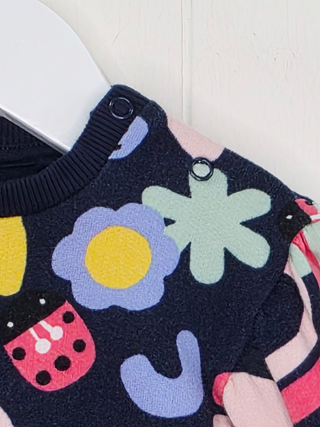 F&F - up to 1 month girls navy blue long-sleeved dress featuring a colorful abstract rainbow and floral print