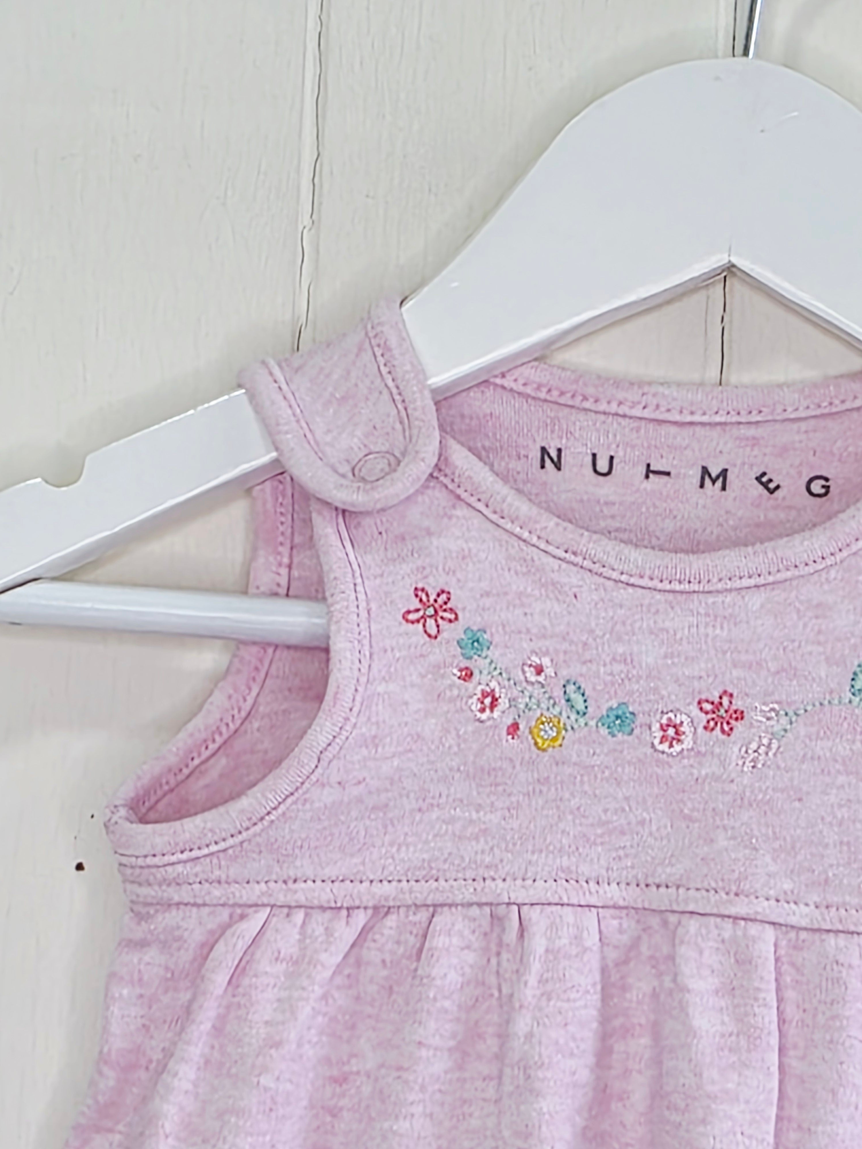 Nutmeg - newborn pink pinafore dress featuring floral embroidery and a bunny graphic