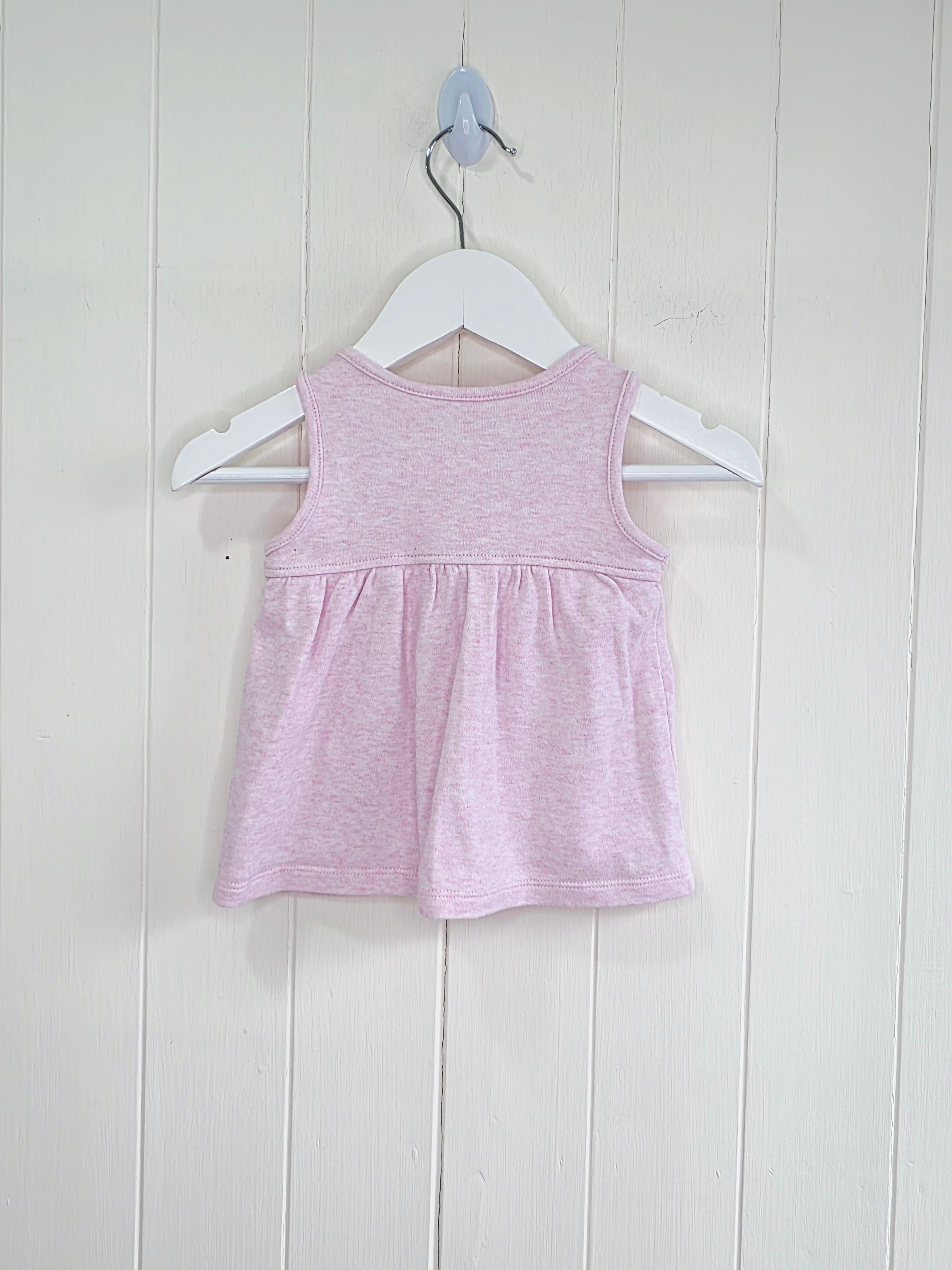 Nutmeg - newborn pink pinafore dress featuring floral embroidery and a bunny graphic