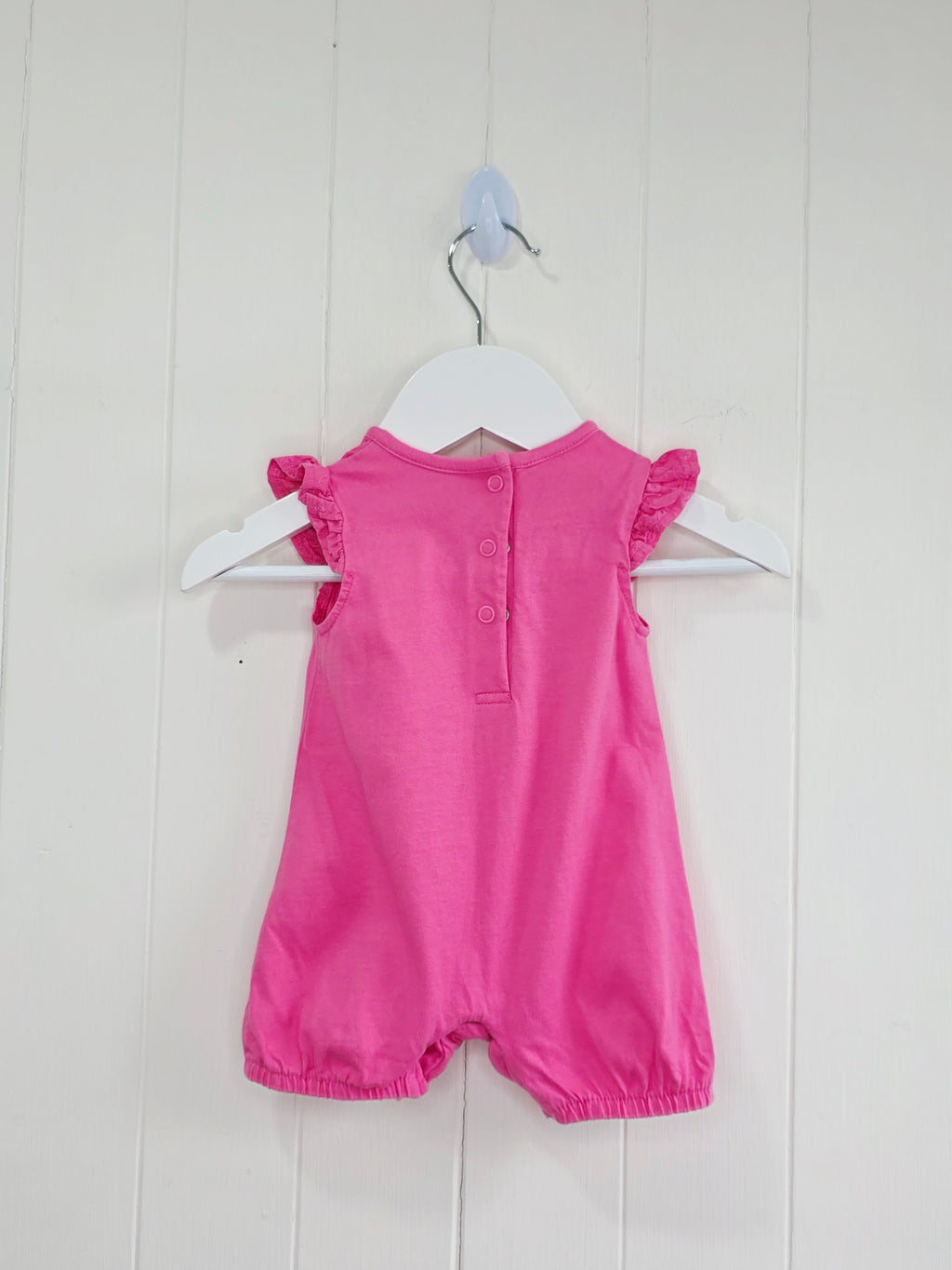 Nutmeg - newborn girls romper featuring broiderie anglaise detailing
