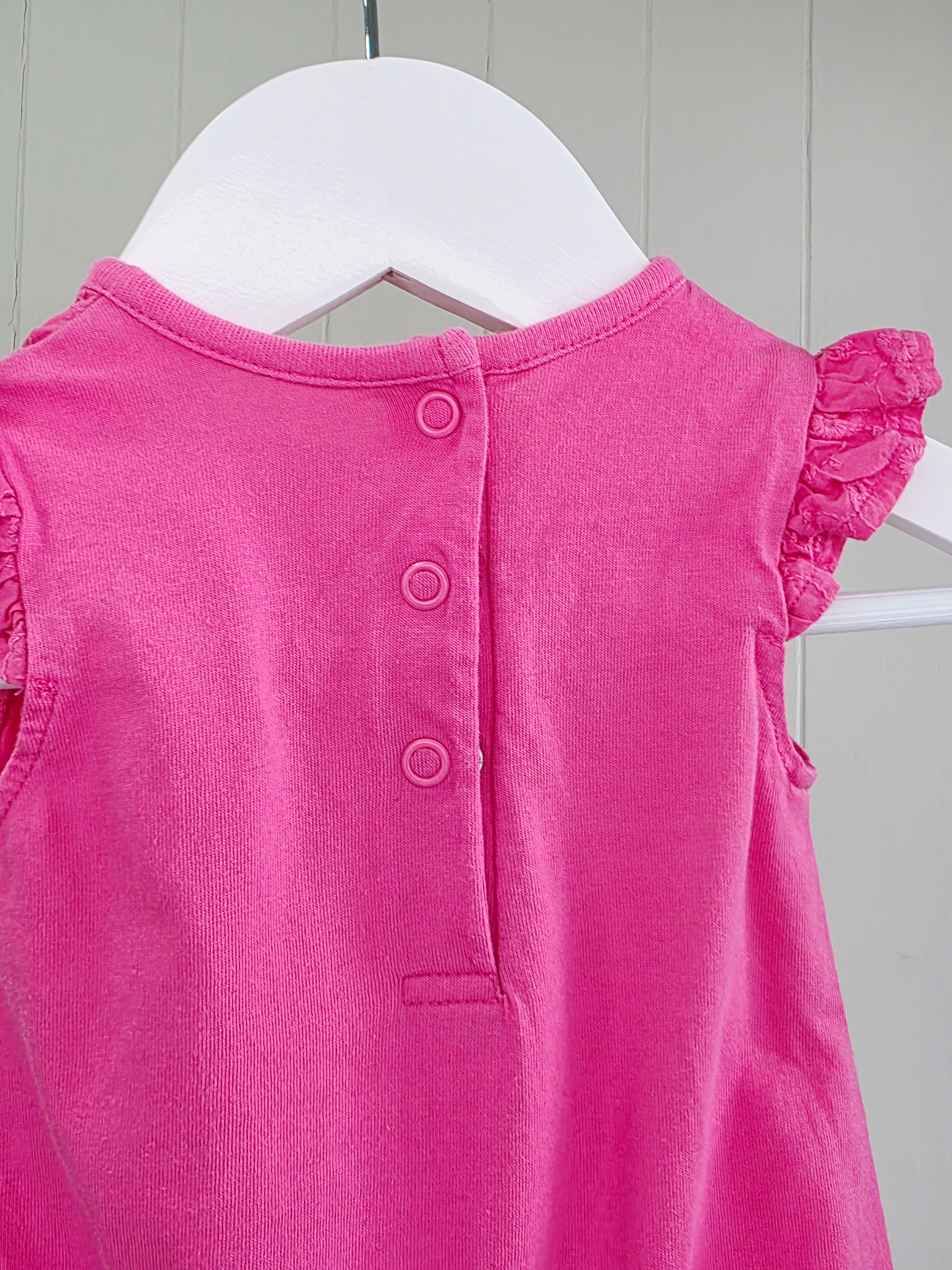 Nutmeg - newborn girls romper featuring broiderie anglaise detailing