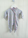 Next - Up to 1 month floral sleepsuit featuring popper closure and frill details