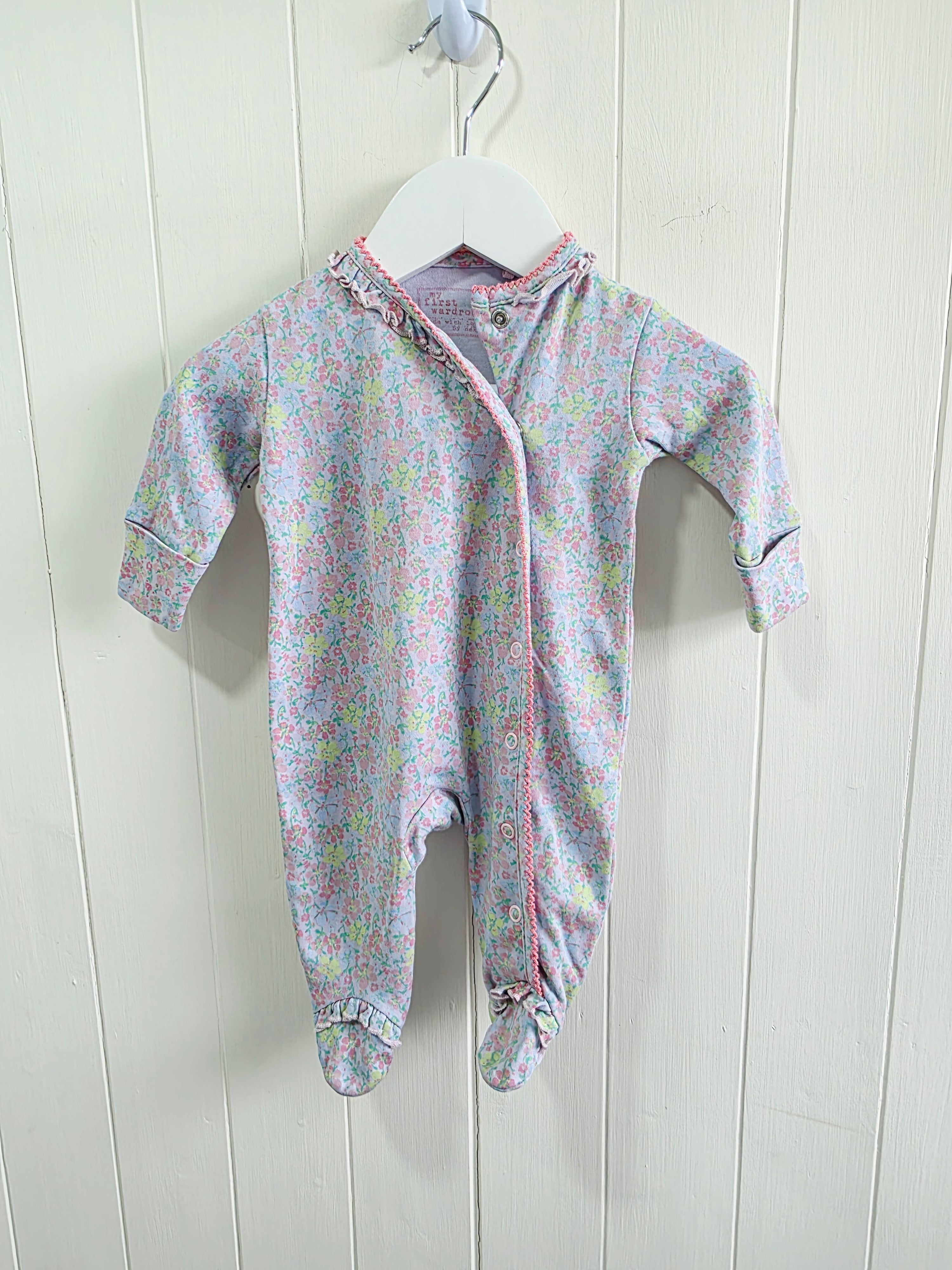 Next - Up to 1 month floral sleepsuit featuring popper closure and frill details
