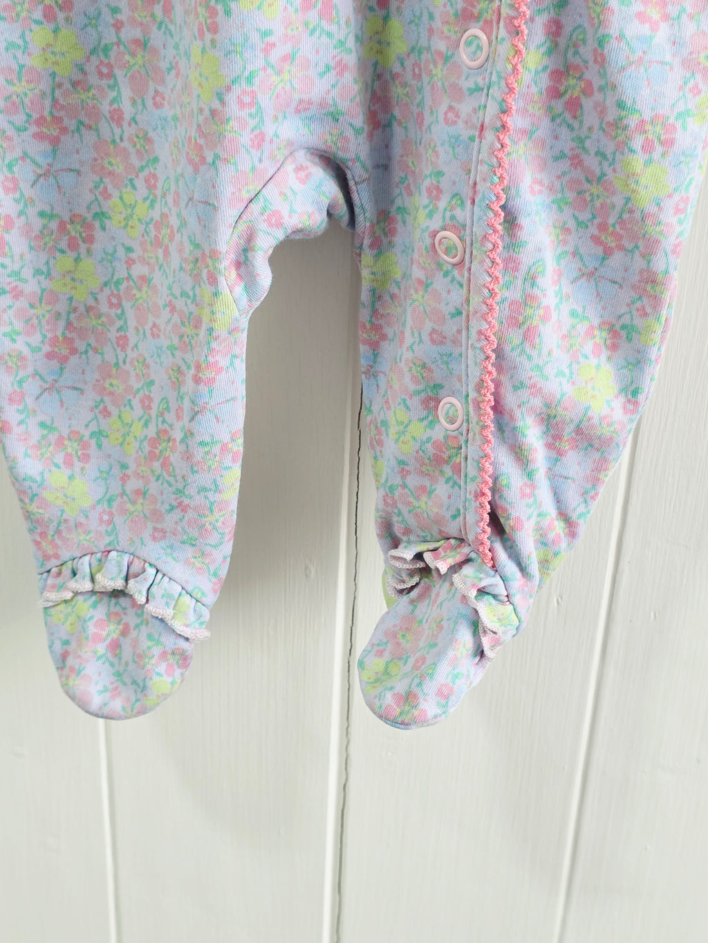 Next - Up to 1 month floral sleepsuit featuring popper closure and frill details