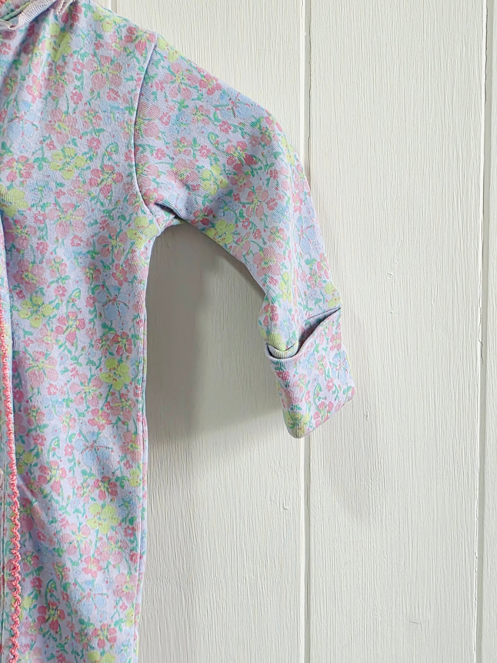 Next - Up to 1 month floral sleepsuit featuring popper closure and frill details