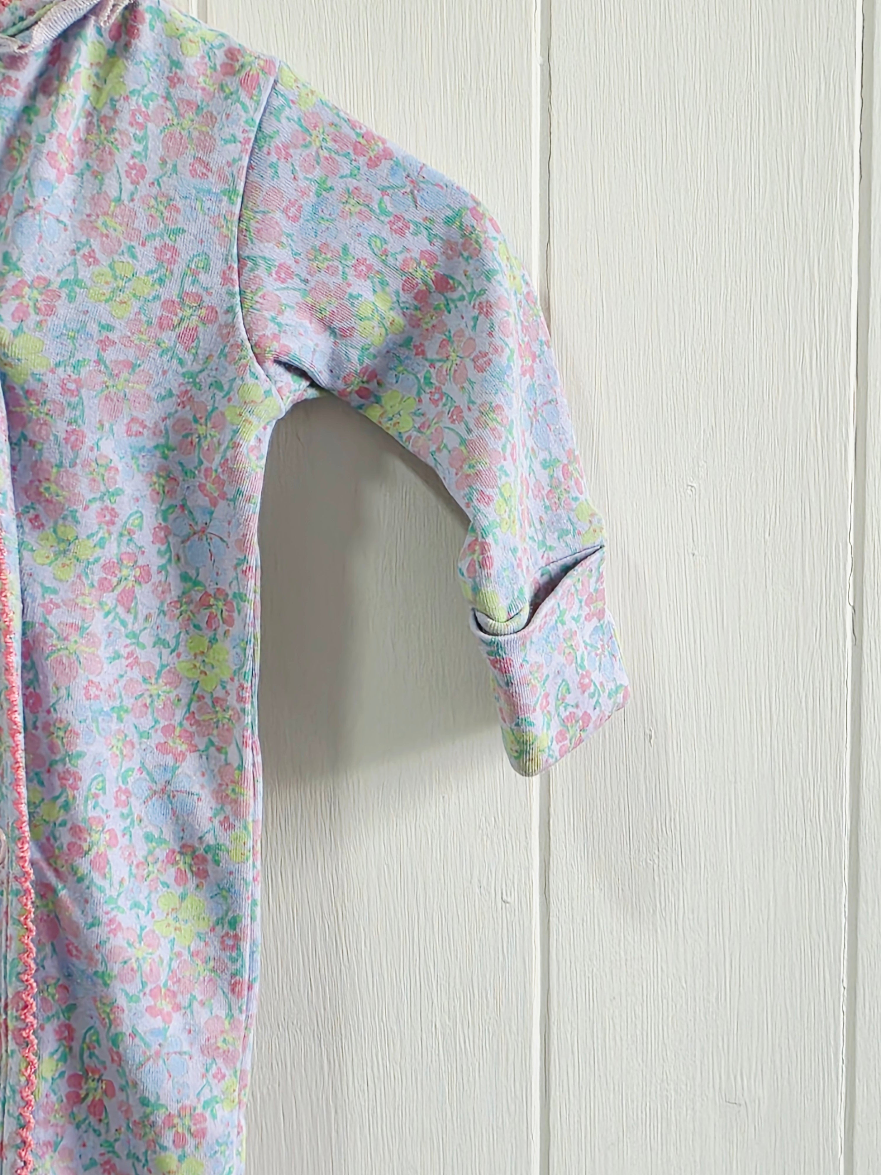 Next - Up to 1 month floral sleepsuit featuring popper closure and frill details