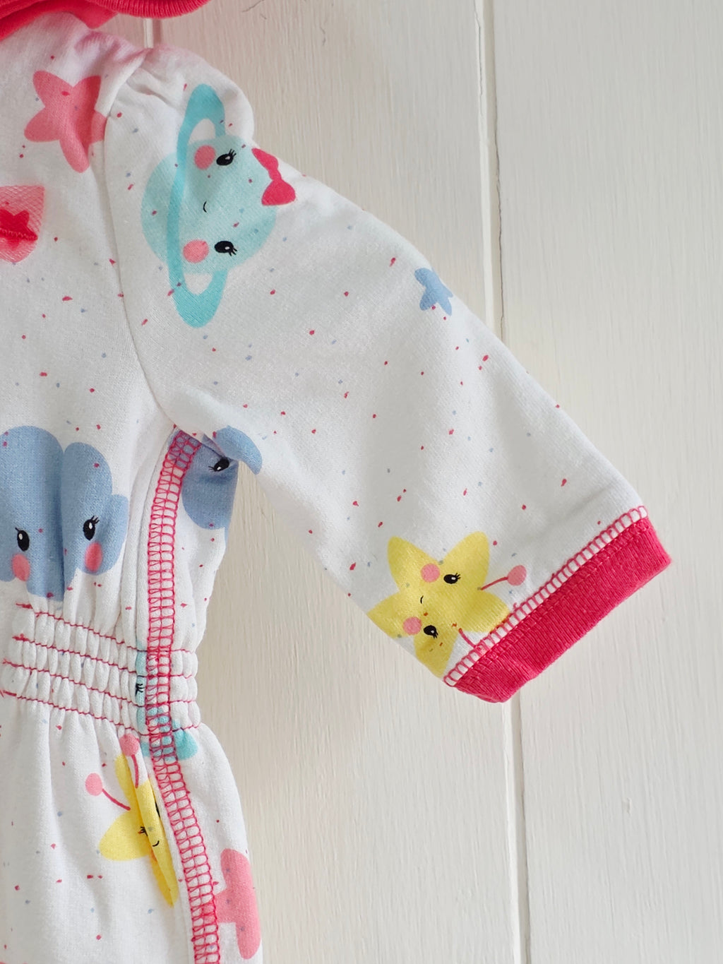 George - First size "Cosmo" hooded baby girl romper featuring a vibrant space-themed print and pink trim