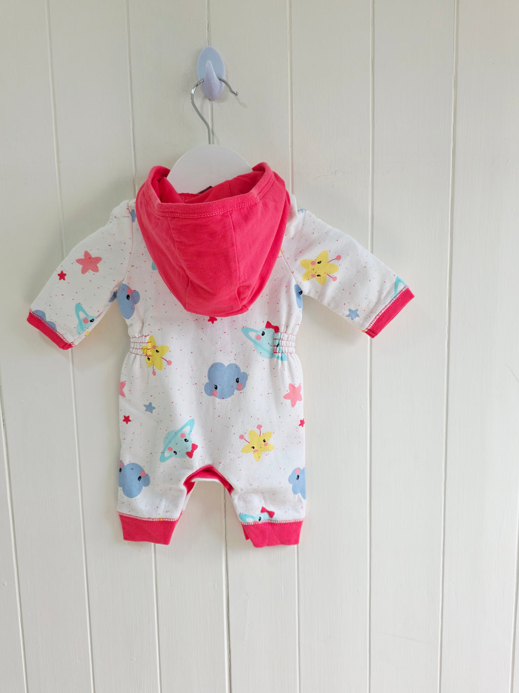 George - First size "Cosmo" hooded baby girl romper featuring a vibrant space-themed print and pink trim