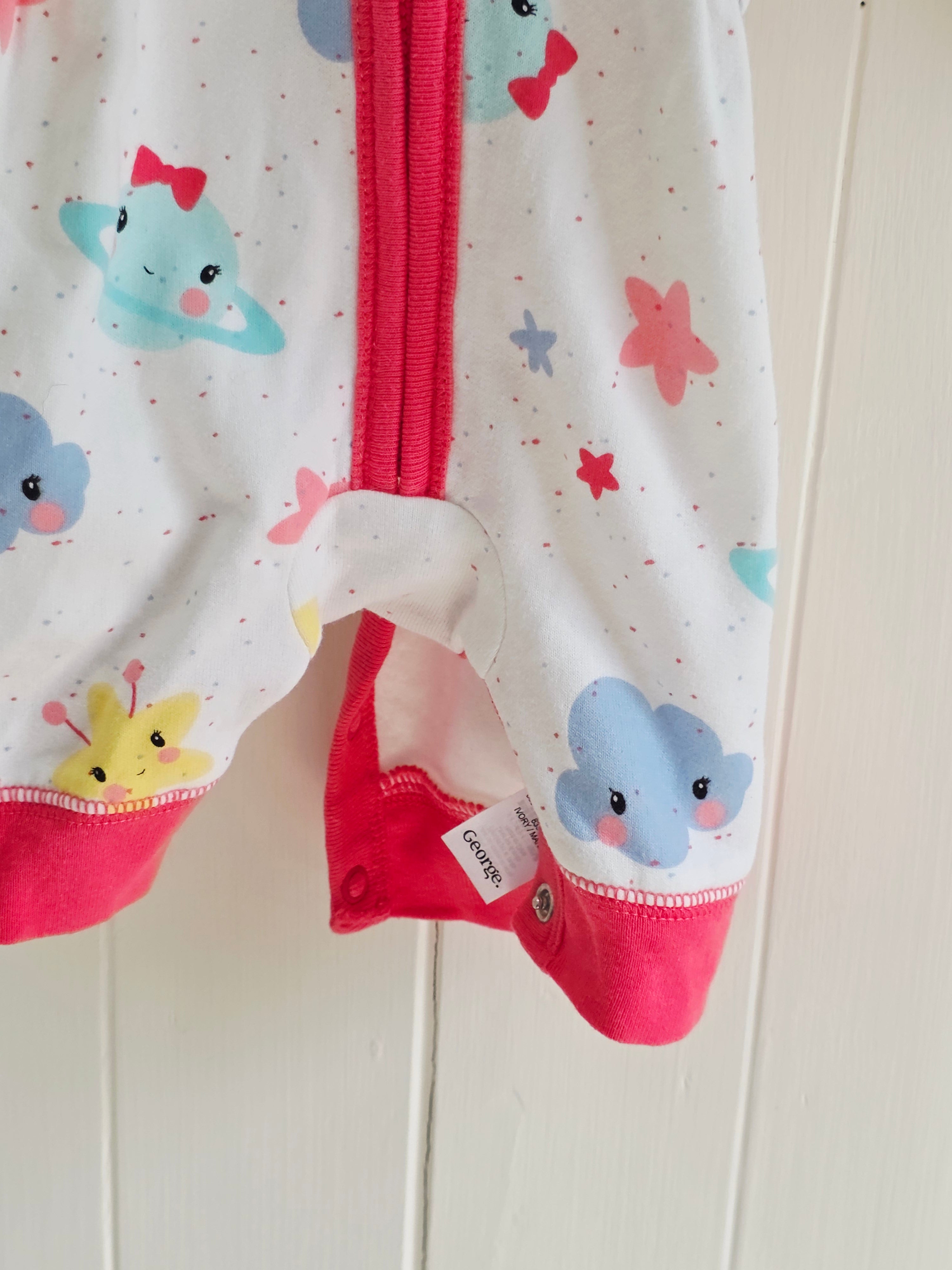 George - First size "Cosmo" hooded baby girl romper featuring a vibrant space-themed print and pink trim