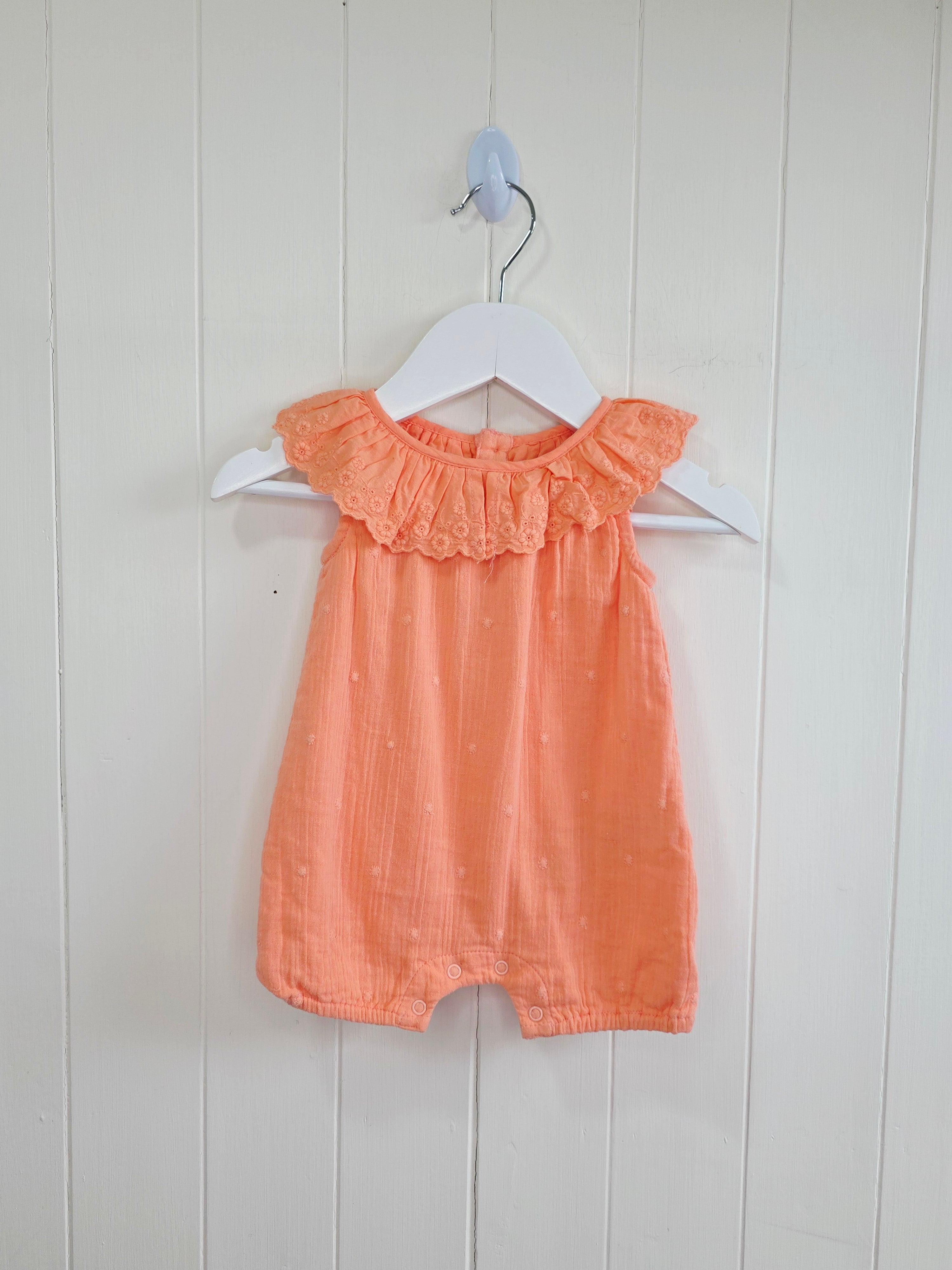 Primark - 0-3 months coral romper with a frilled neckline and easy popper fastening