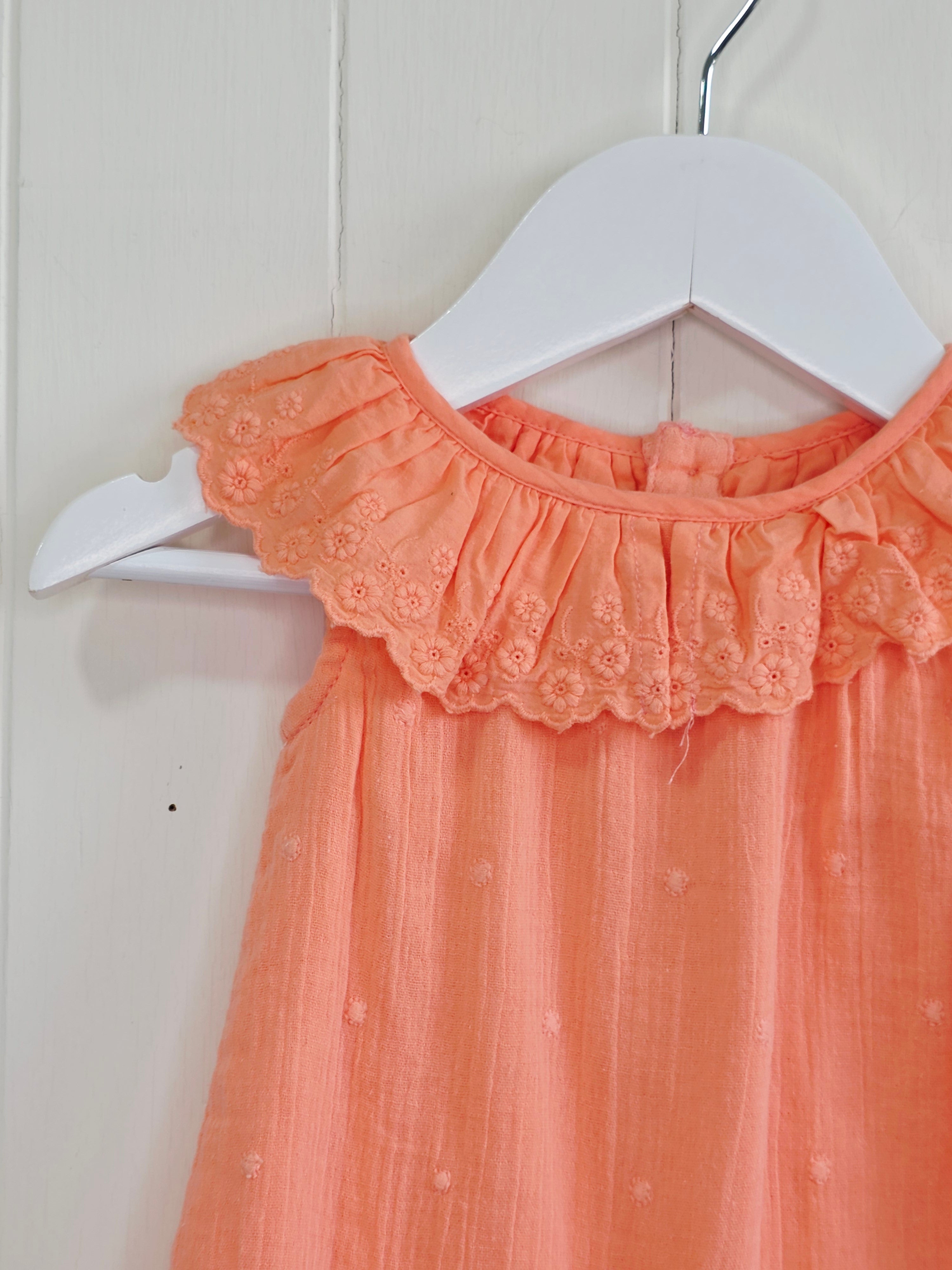 Primark - 0-3 months coral romper with a frilled neckline and easy popper fastening