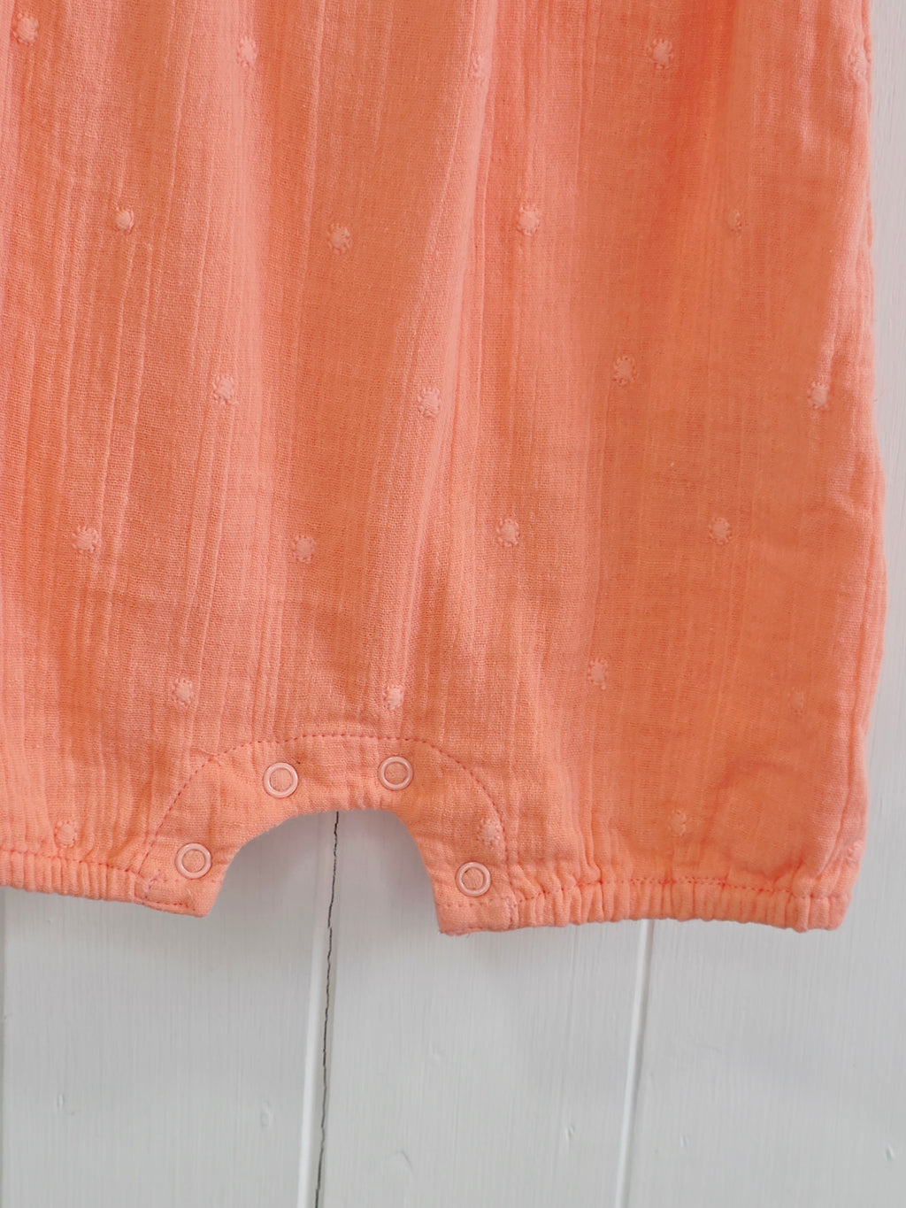 Primark - 0-3 months coral romper with a frilled neckline and easy popper fastening
