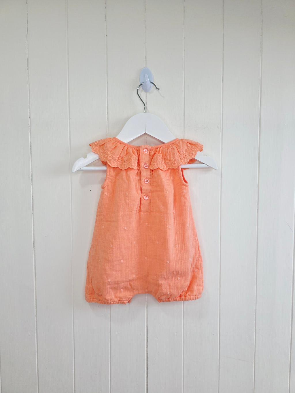 Primark - 0-3 months coral romper with a frilled neckline and easy popper fastening