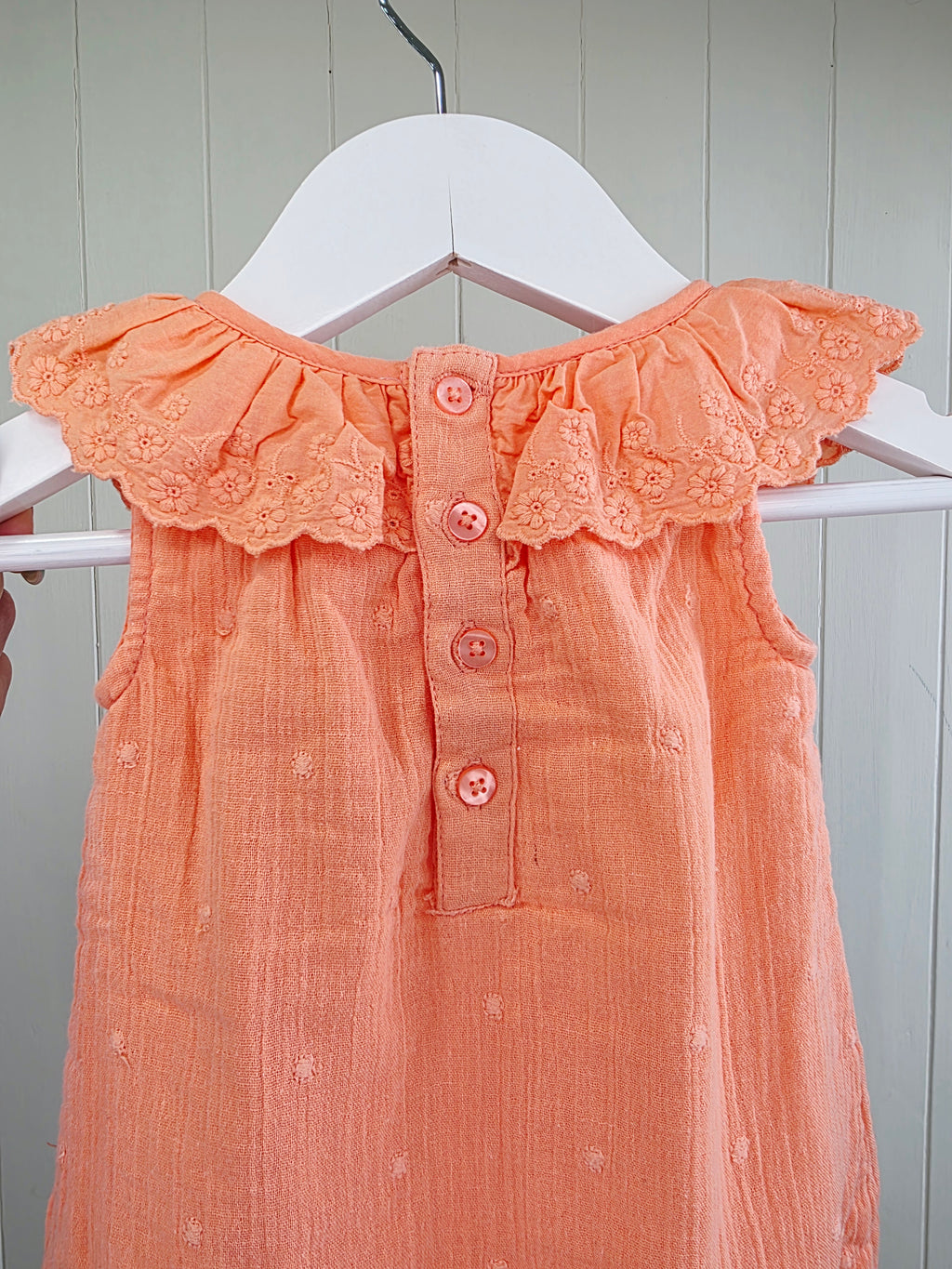 Primark - 0-3 months coral romper with a frilled neckline and easy popper fastening