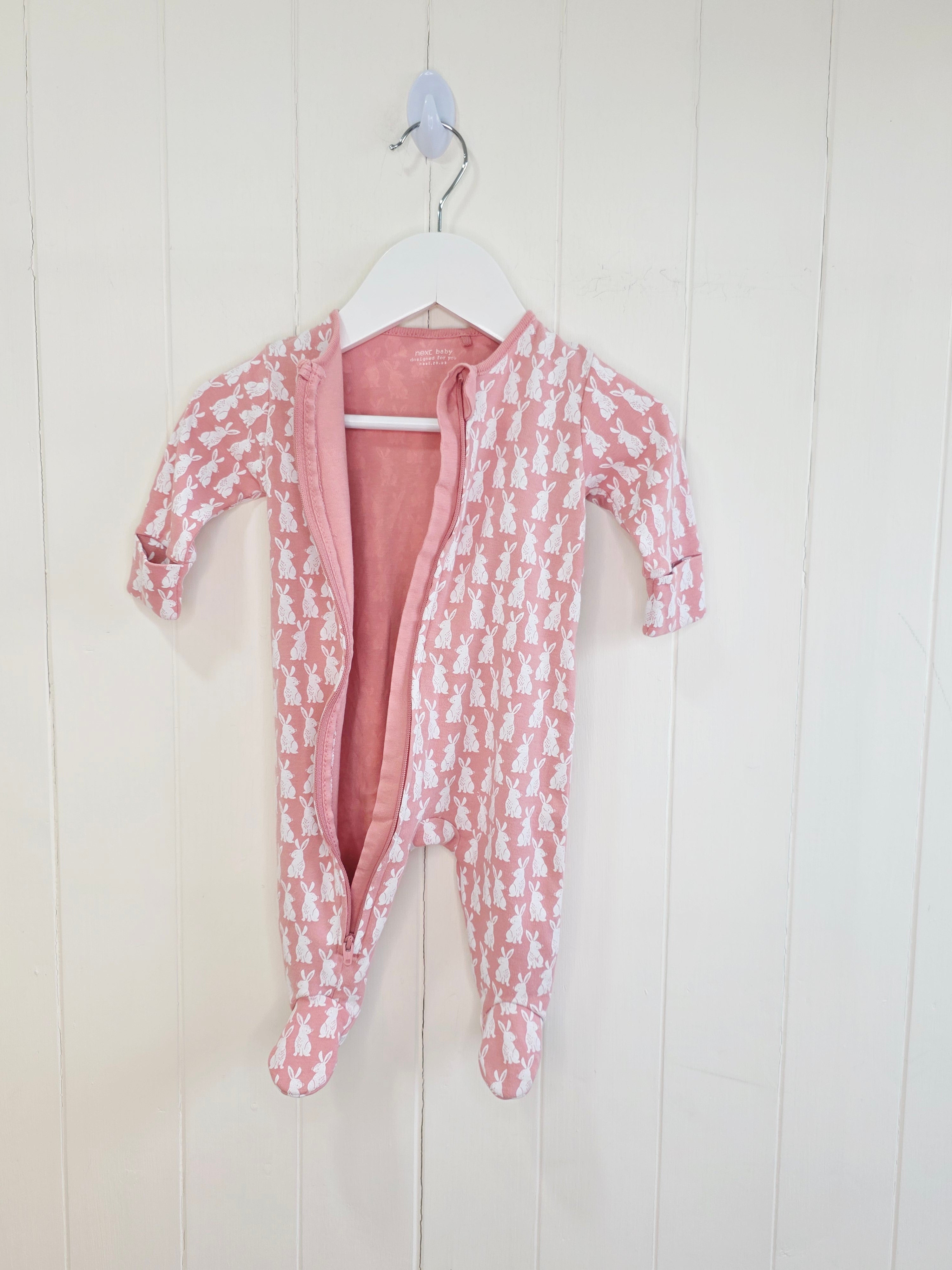 Next - up to 3 months girls pink buny print zip up sleepsuit