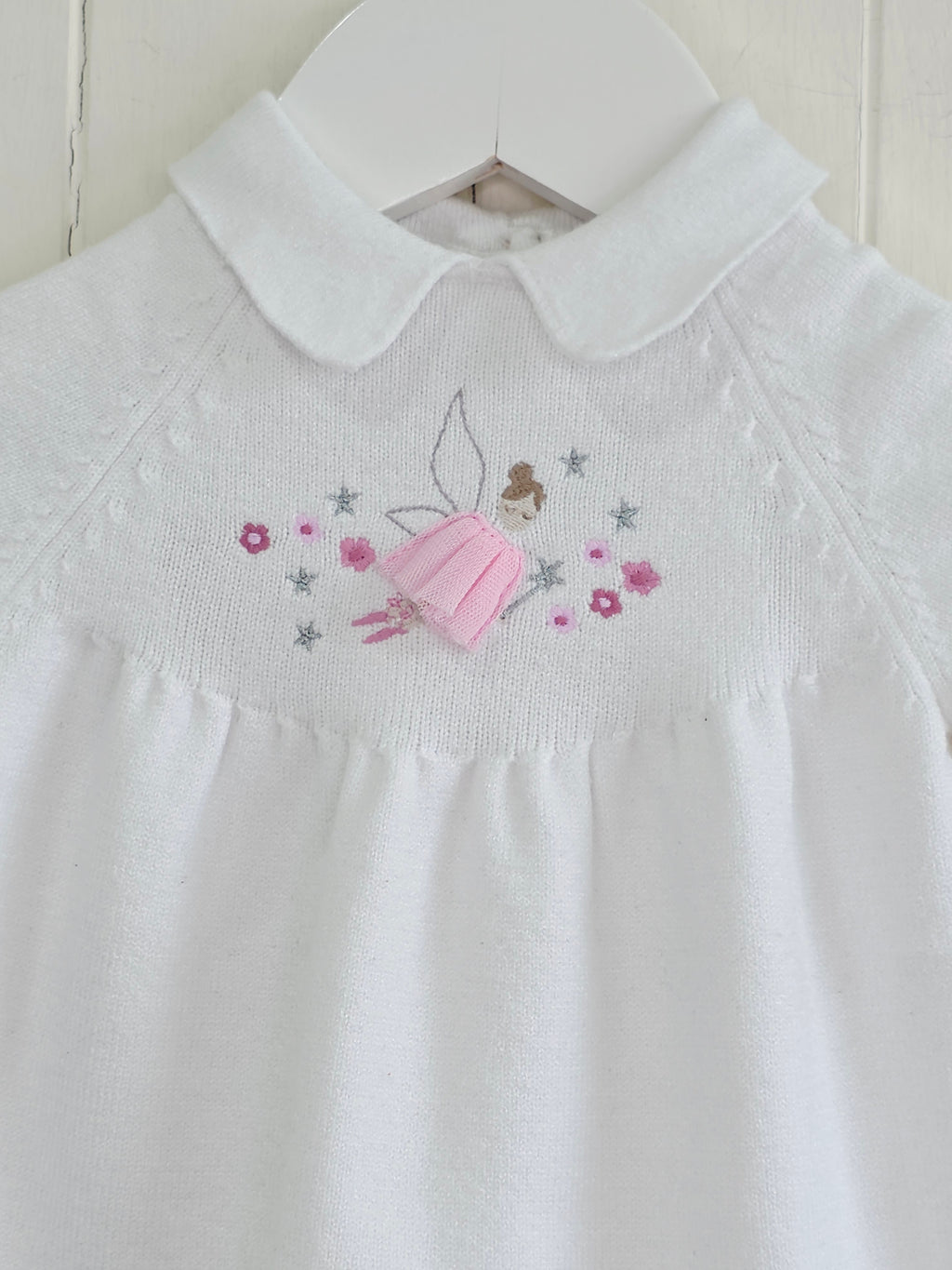 Nutmeg - 0-3 months white knitted dress featuring embroidered fairy details and Peter Pan collar