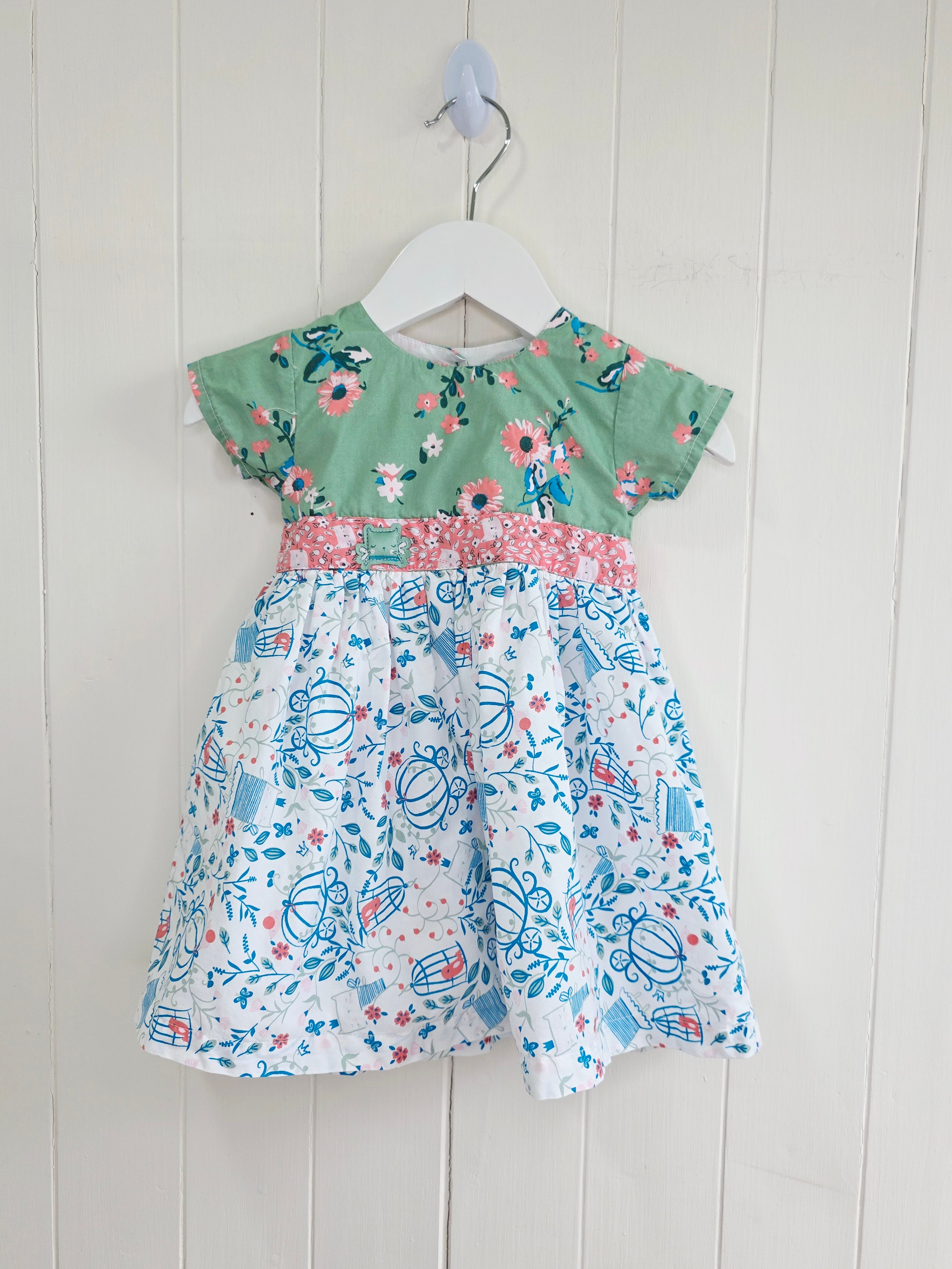 The essential one - 3-6 months green floral bodice and a white skirt printed with blue outlines of cages and flowers dress