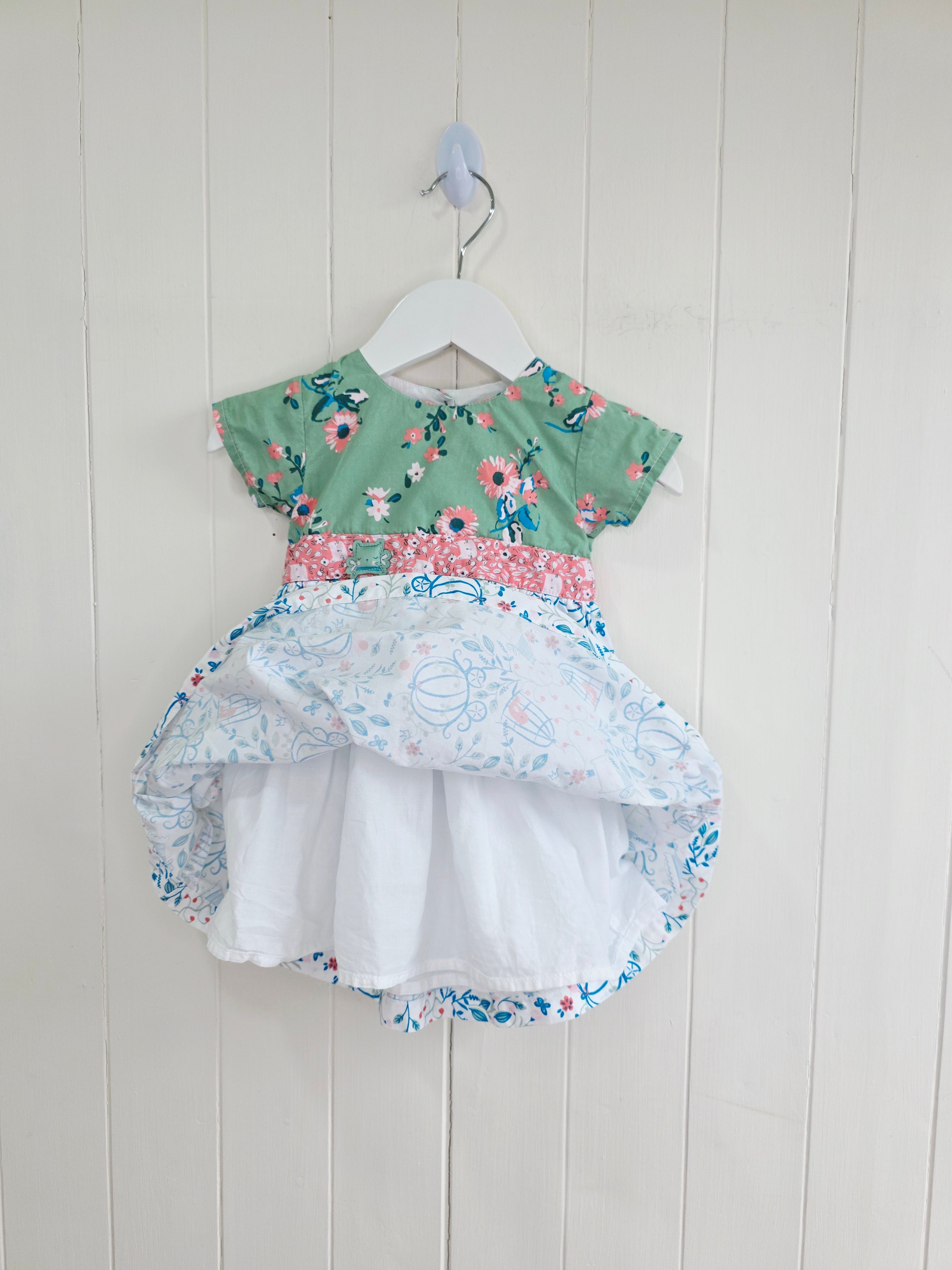 The essential one - 3-6 months green floral bodice and a white skirt printed with blue outlines of cages and flowers dress