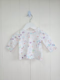 Nutmeg - 0-3 months girls white doodle print long sleeve top