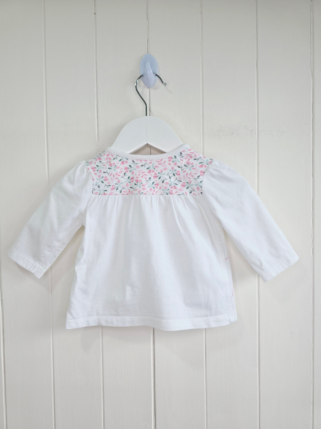 Nutmeg -0-3 months girls white long sleeve top featuring floral yoke and elephant applique