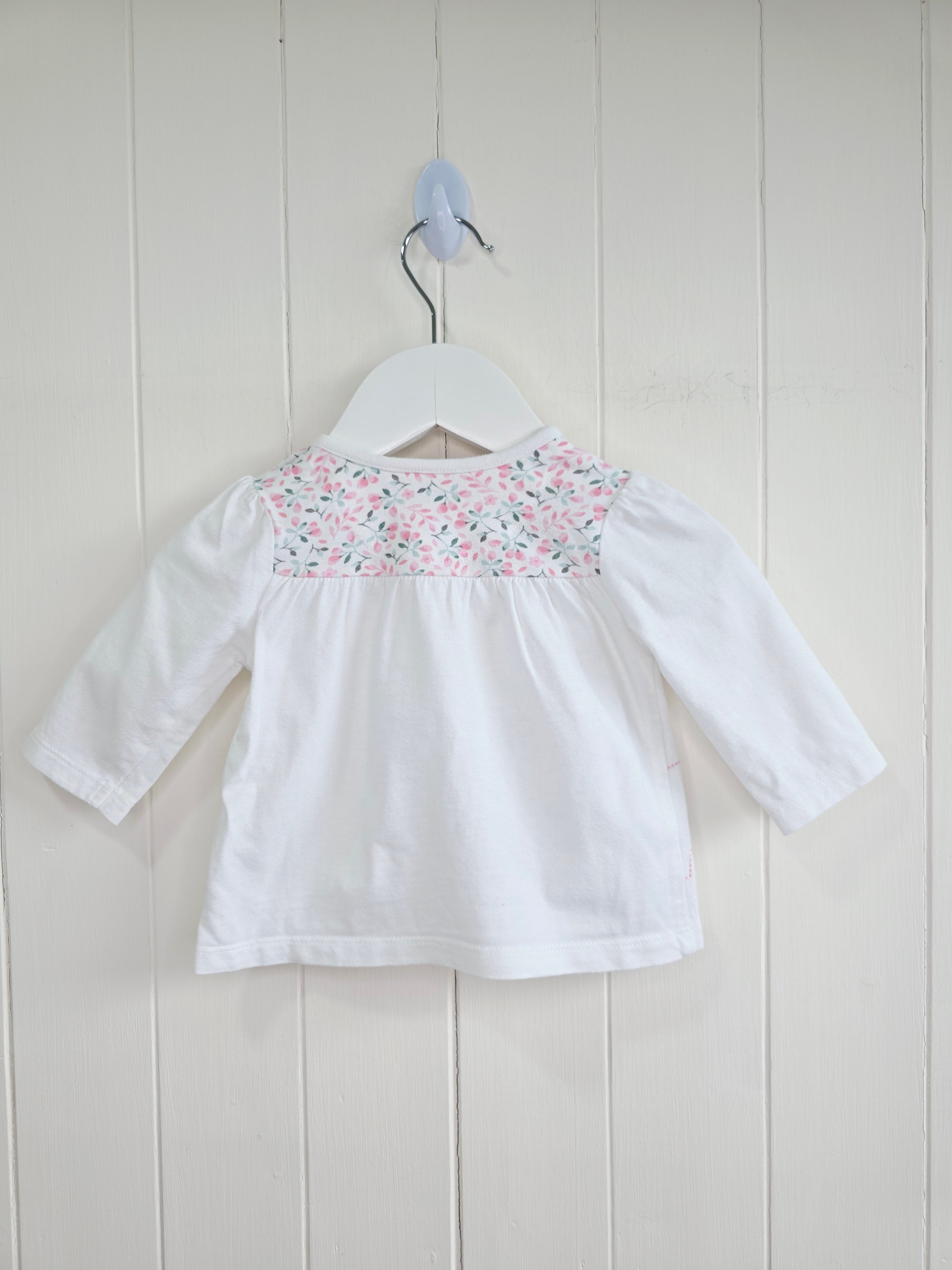 Nutmeg -0-3 months girls white long sleeve top featuring floral yoke and elephant applique