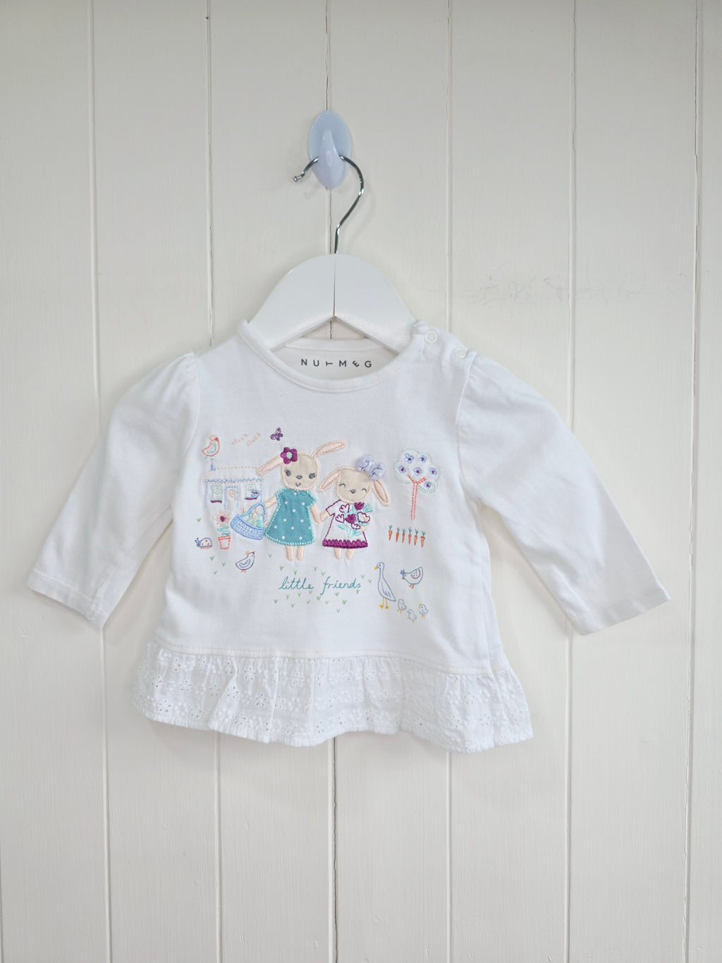 Nutmeg - 0-3 months white top features detailed "little friends" bunny embroidery and a lace-trimmed hem