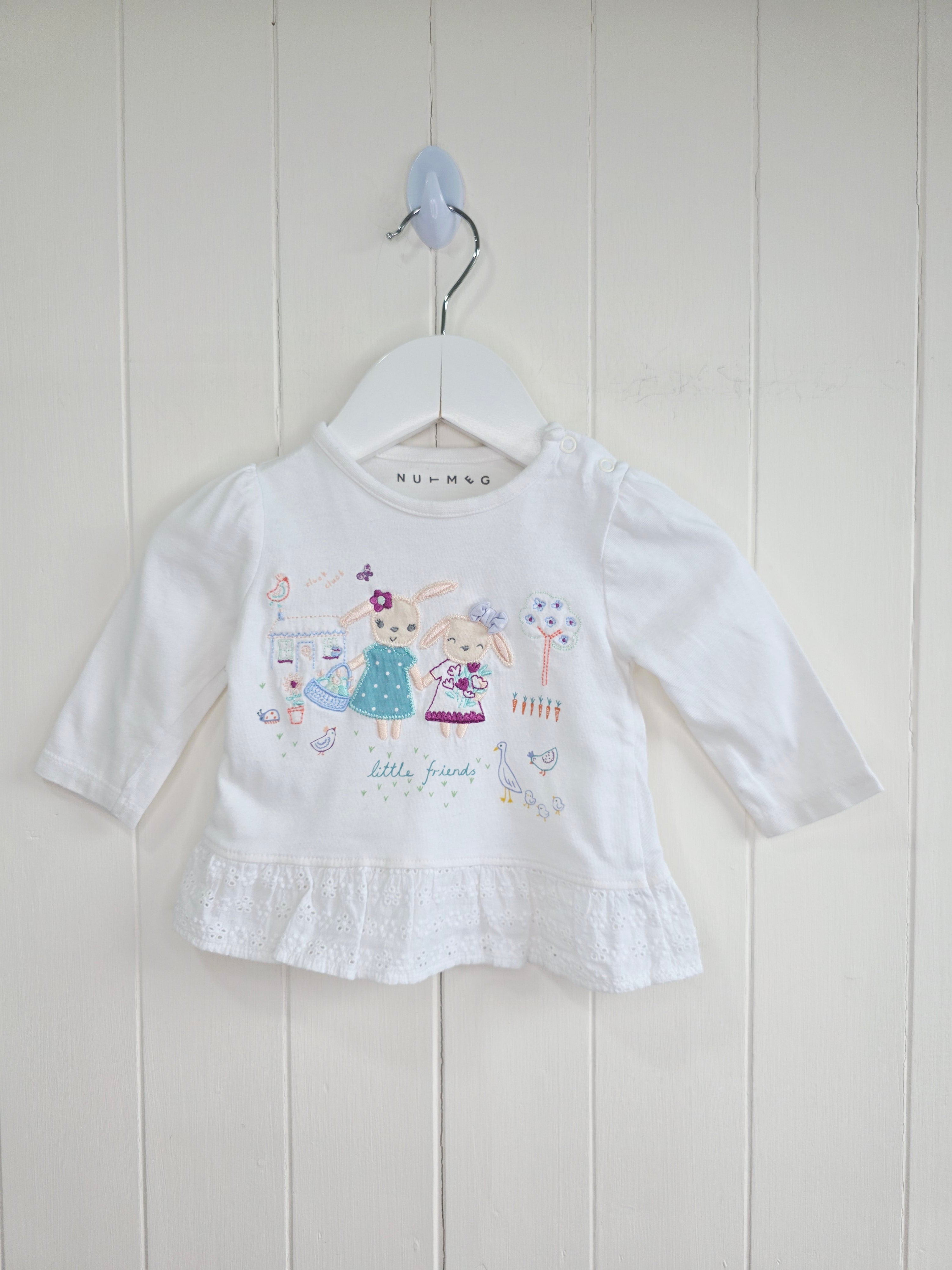Nutmeg - 0-3 months white top features detailed "little friends" bunny embroidery and a lace-trimmed hem