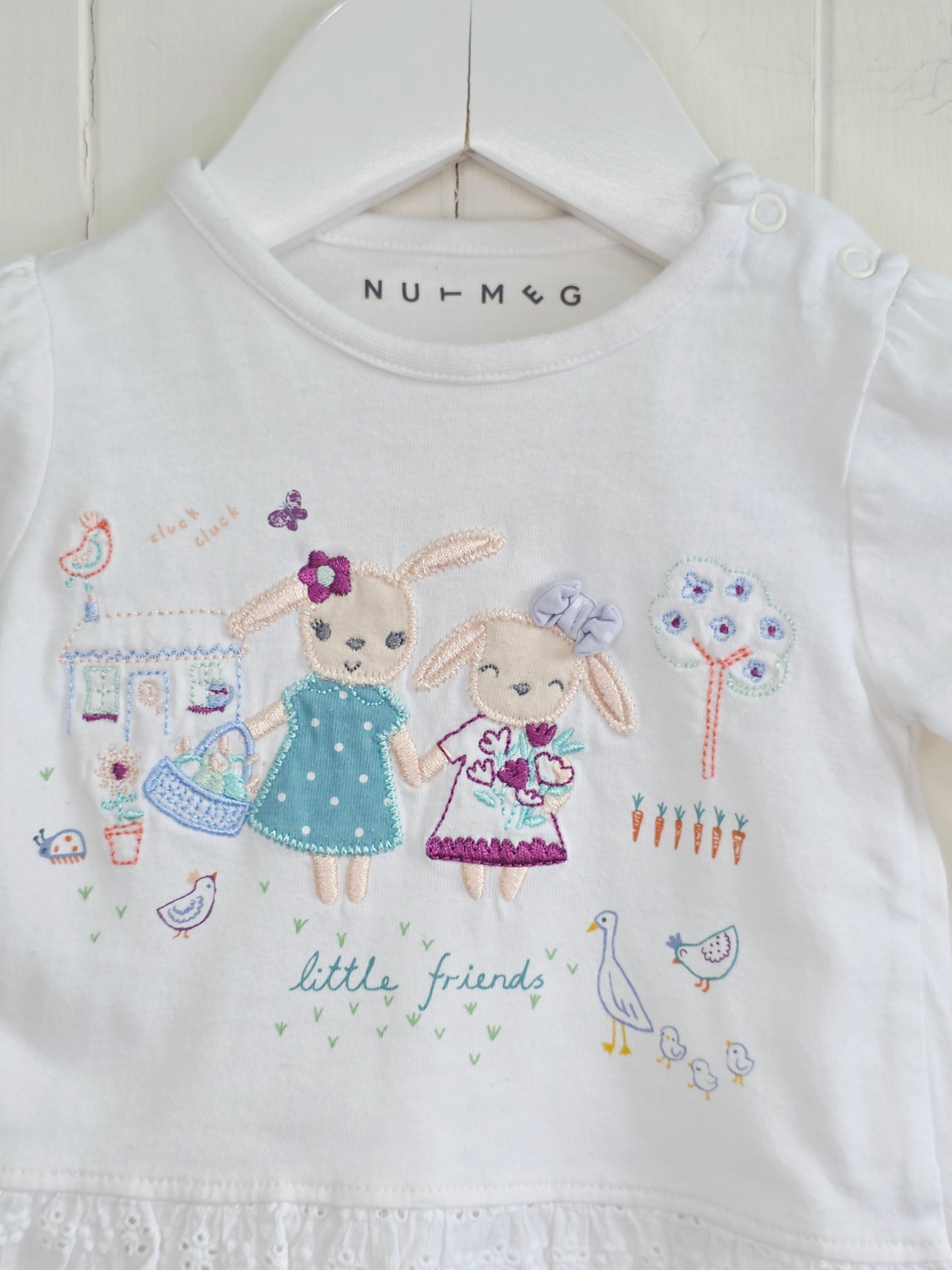 Nutmeg - 0-3 months white top features detailed "little friends" bunny embroidery and a lace-trimmed hem