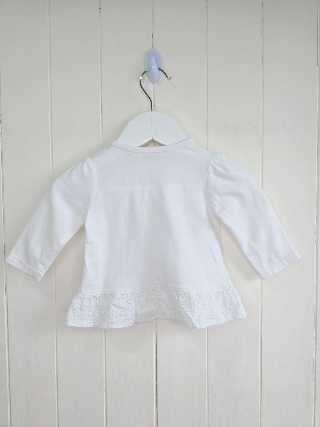 Nutmeg - 0-3 months white top features detailed "little friends" bunny embroidery and a lace-trimmed hem