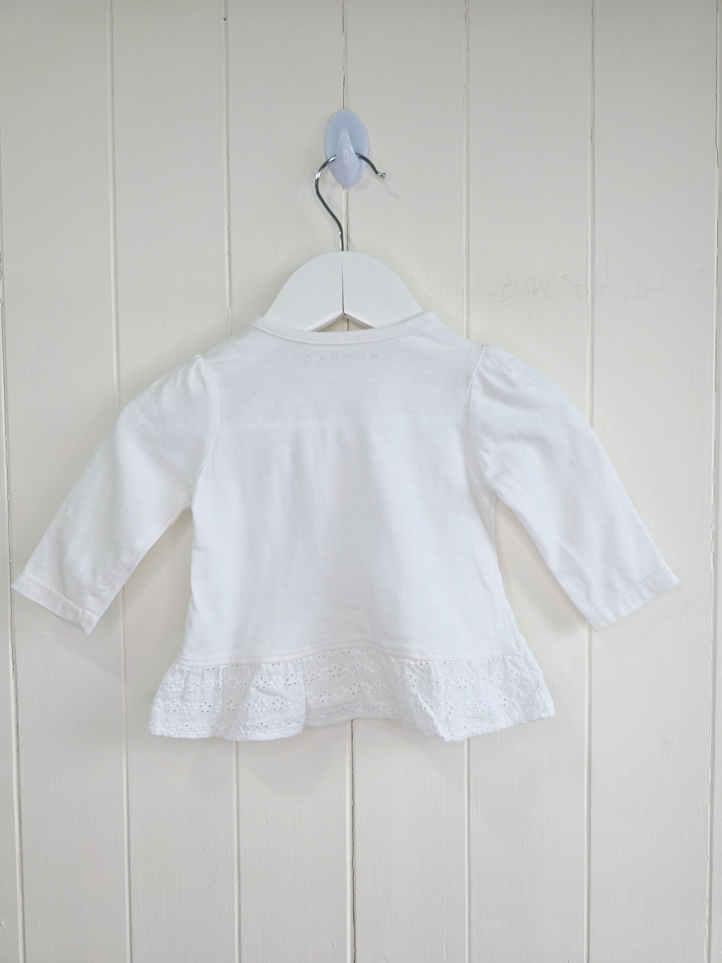 Nutmeg - 0-3 months white top features detailed "little friends" bunny embroidery and a lace-trimmed hem