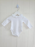 Nutmeg - 0-3 months girls bodysuit features a delicate white embroidered frill collar and long sleeves