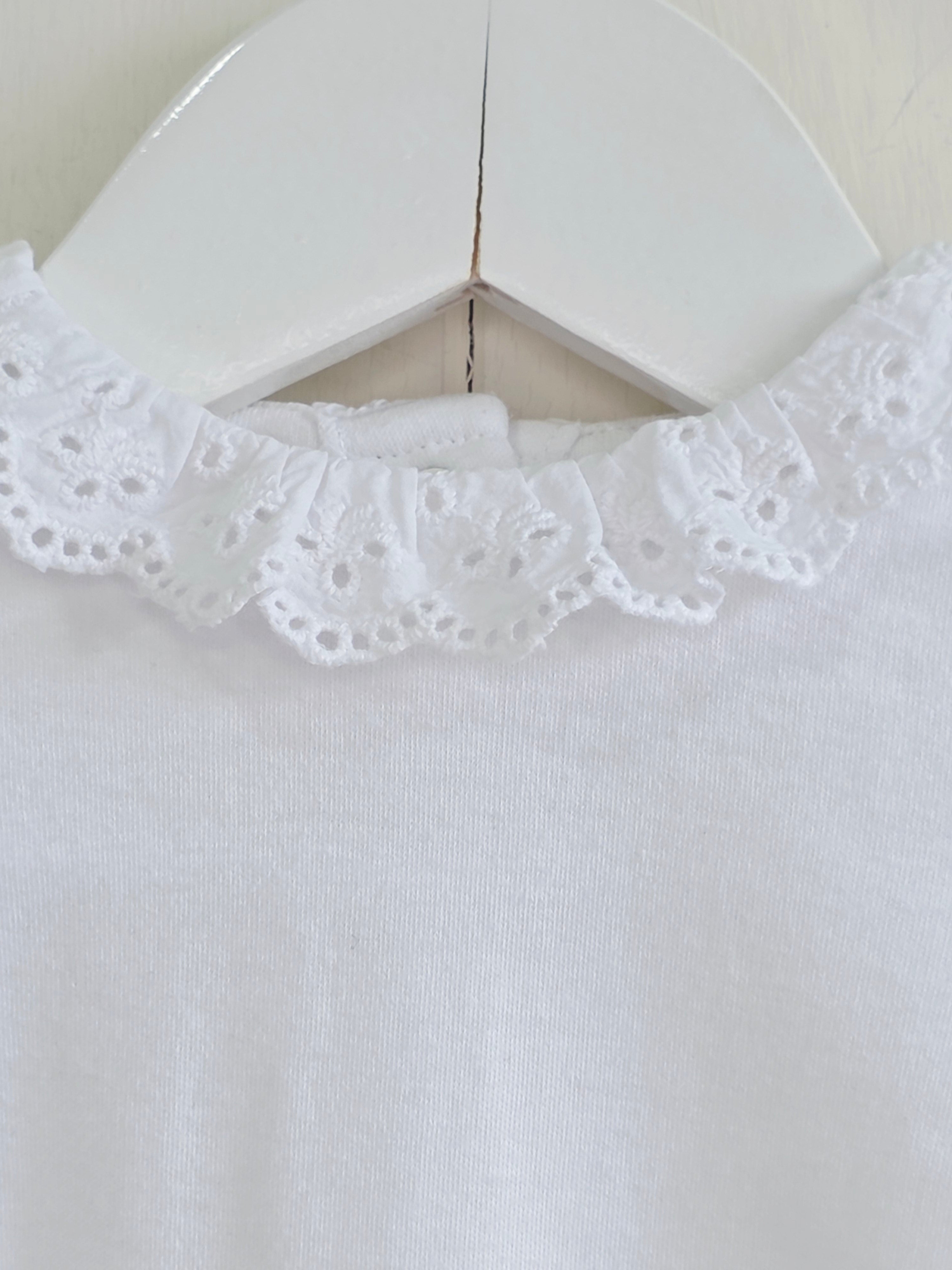 Nutmeg - 0-3 months girls bodysuit features a delicate white embroidered frill collar and long sleeves
