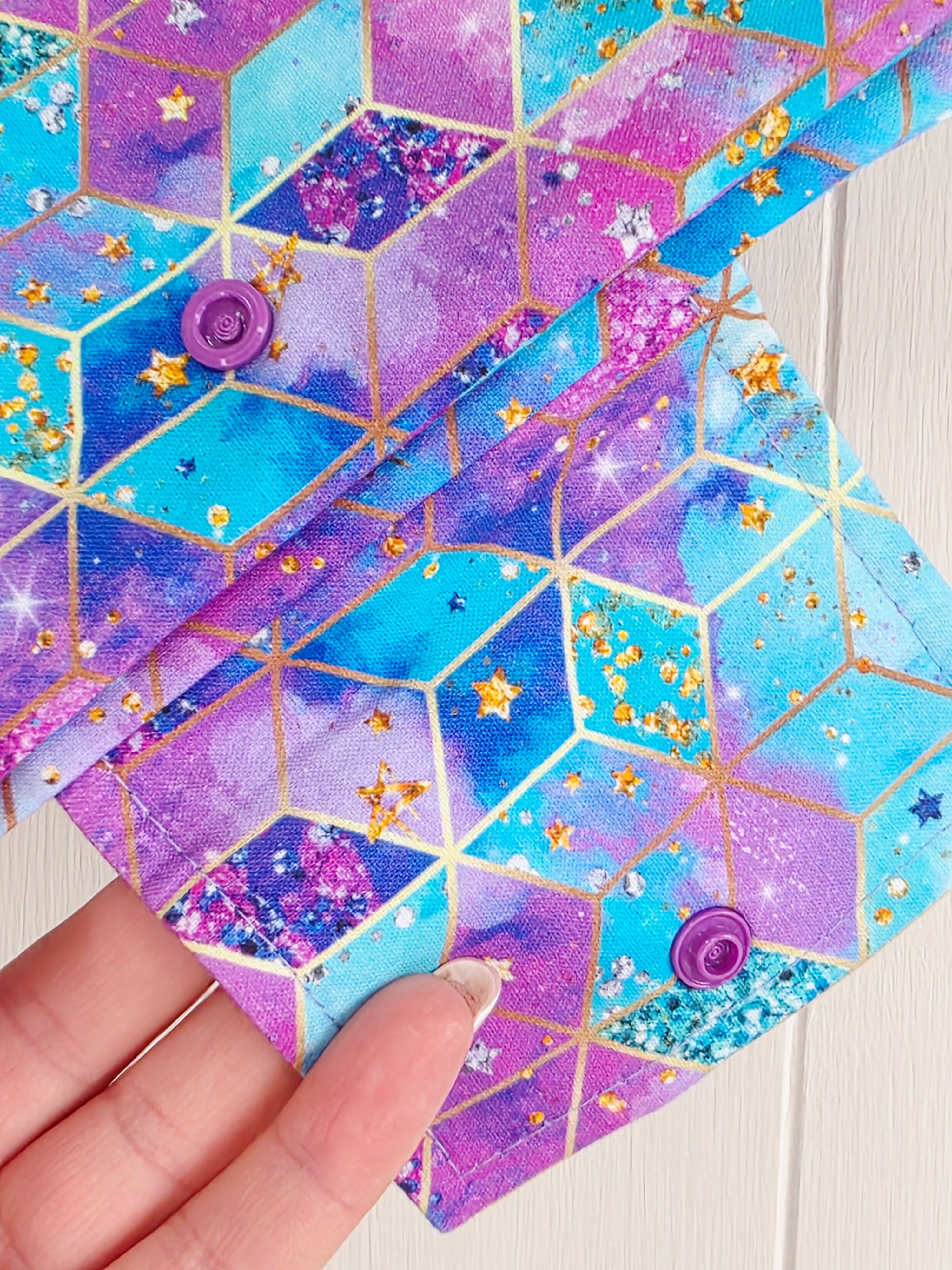 Handmade - mini nappies and wet wipes wallet featuring colorful geometric "Cosmic Squares" design in shades of aqua and violet