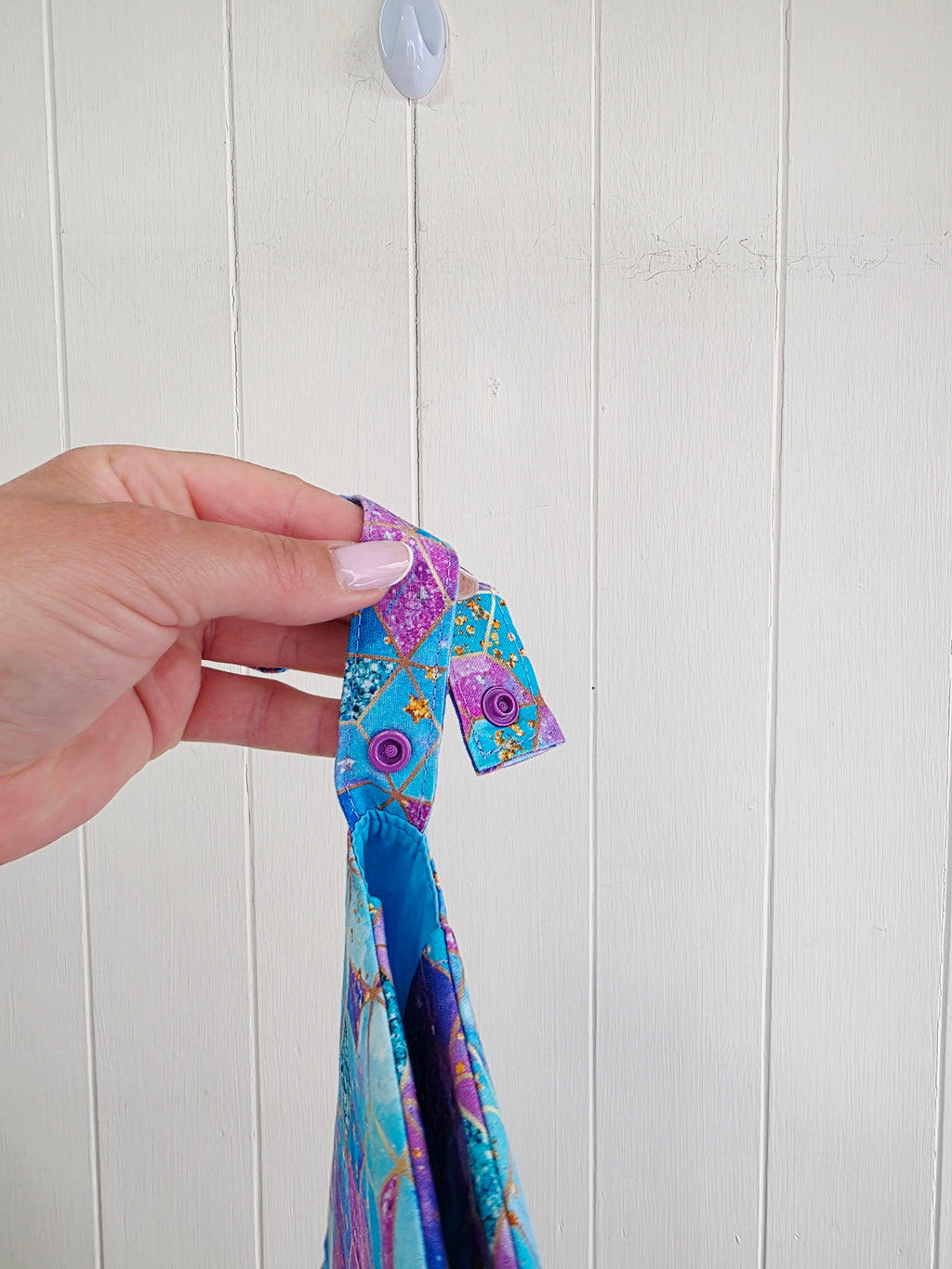 Handmade - mini nappies and wet wipes wallet featuring colorful geometric "Cosmic Squares" design in shades of aqua and violet