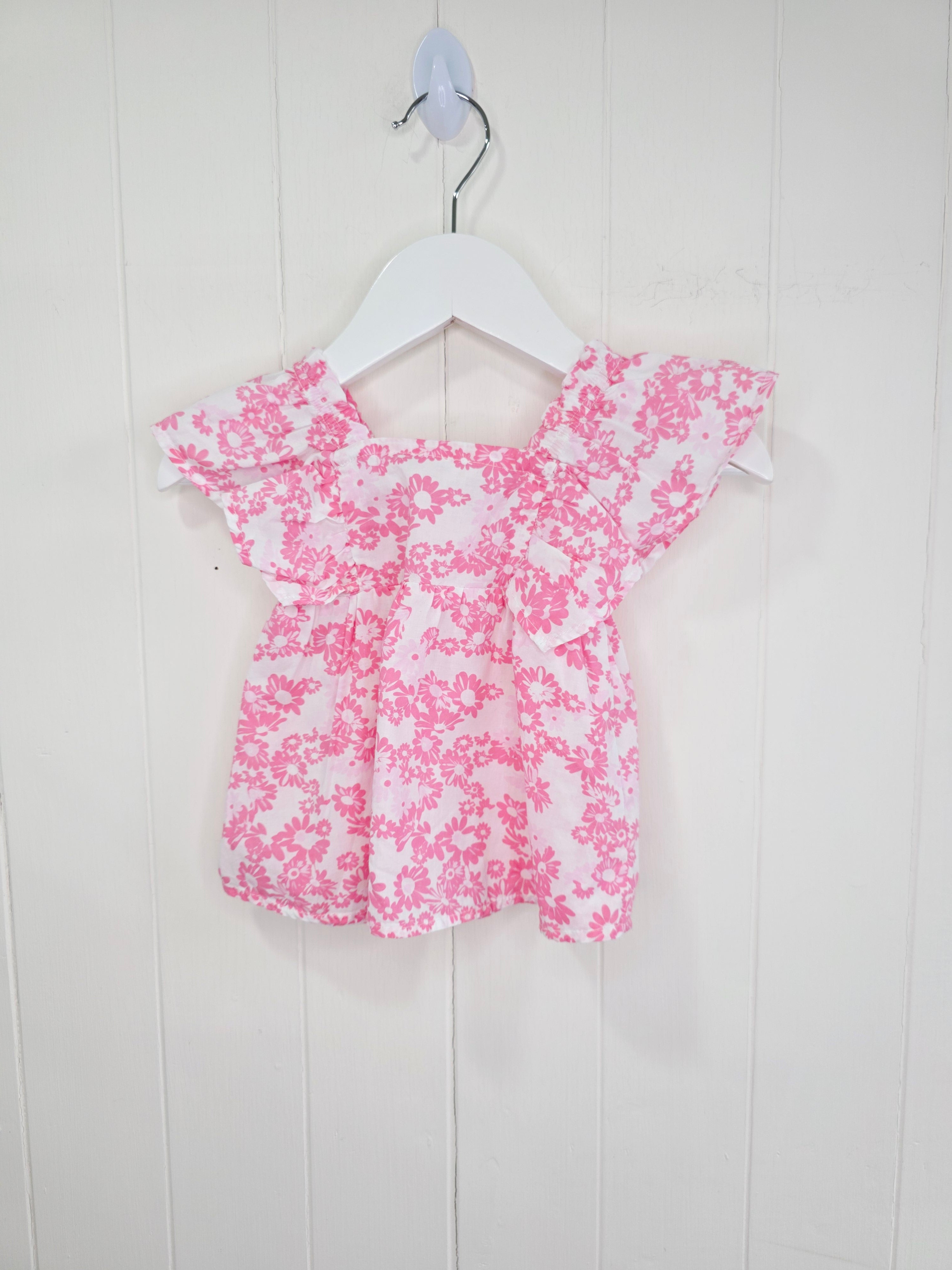Leigh Tucker - 3-6 months white and pink floral cotton top featuring ruffle sleeves