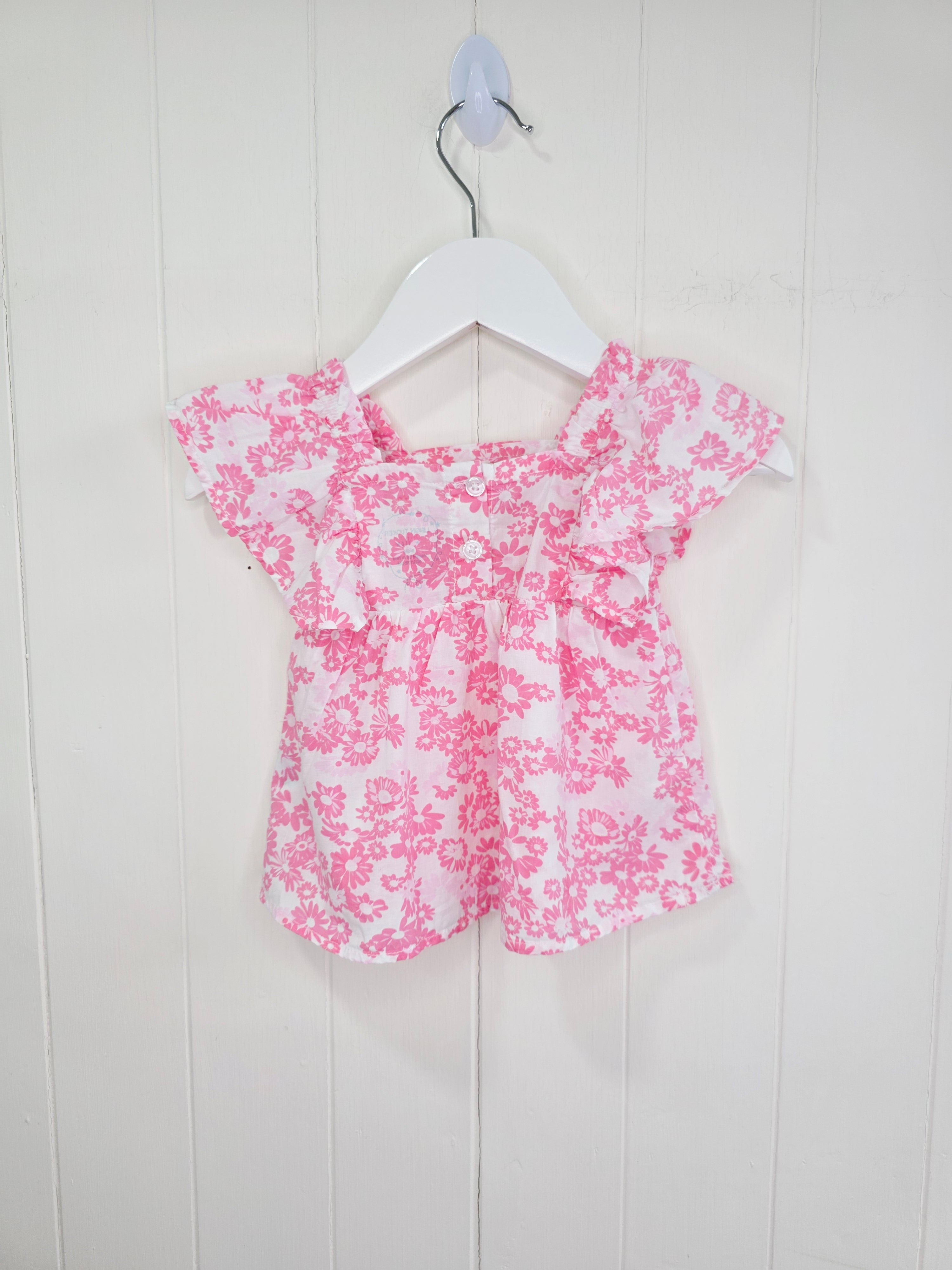 Leigh Tucker - 3-6 months white and pink floral cotton top featuring ruffle sleeves