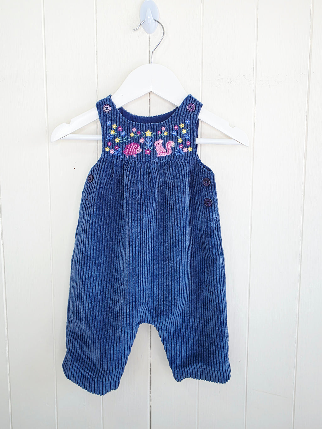 Nutmeg - 3-6 months navy blue corduroy romper features colorful embroidered animal and flower details on the chest