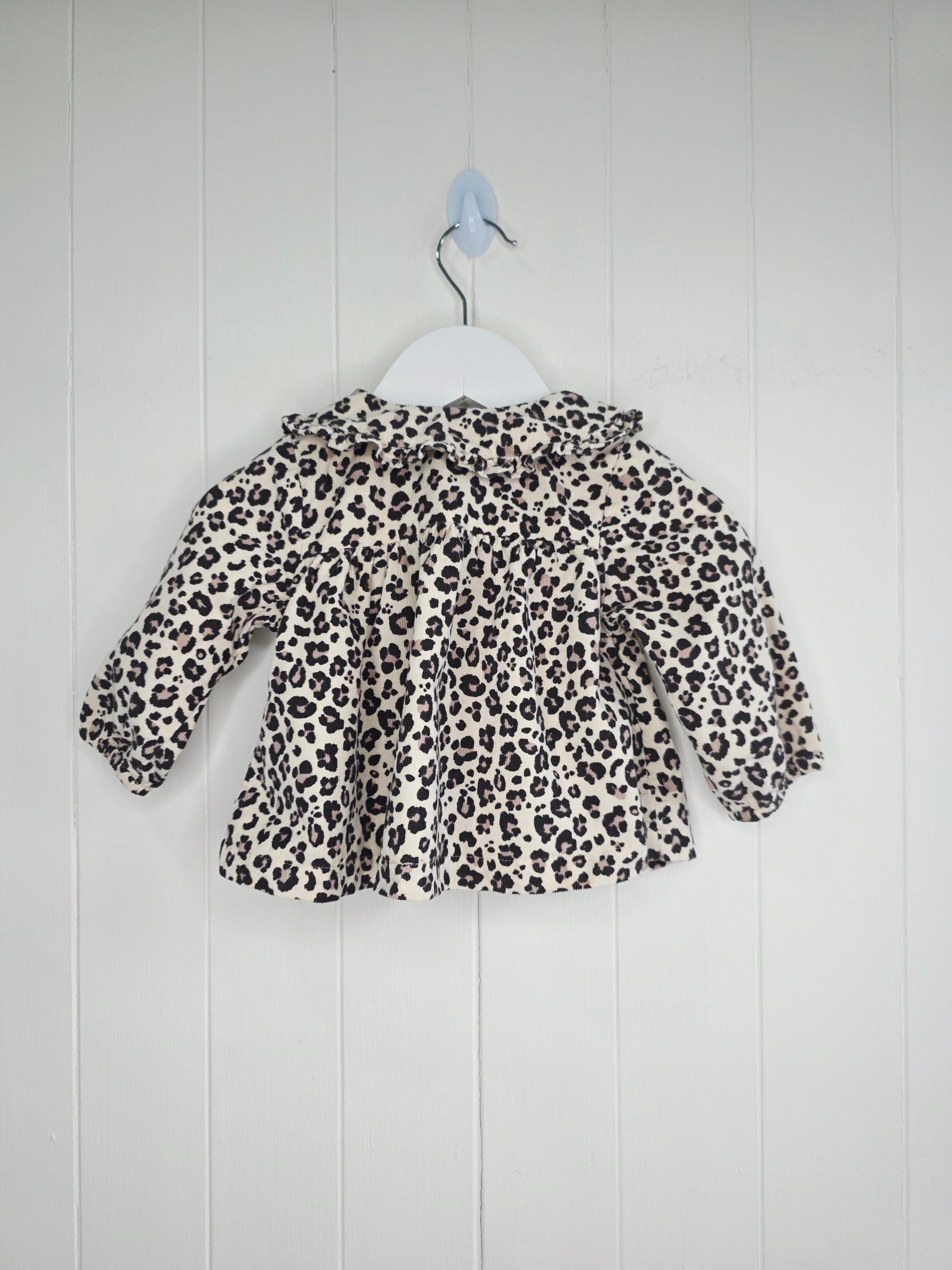 Tu - 3-6 months girls leopard print collared top features a ruffled collar and button-down front