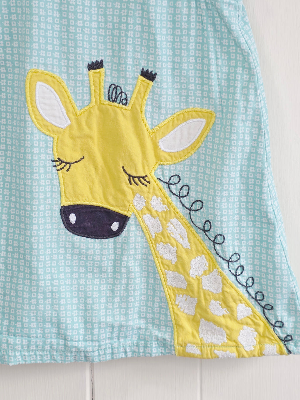 John Lewis - 3-6 months girl's cotton dress features a charming turquoise grid pattern and a large giraffe appliqué