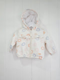 Nutmeg - 3-6 months girls cream hooded jacket featuring faux fur lining and rainbow print