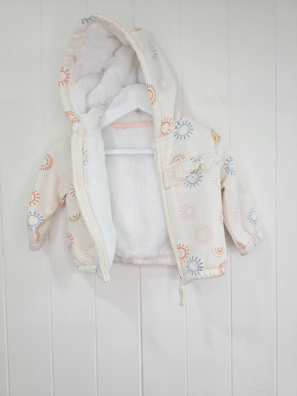 Nutmeg - 3-6 months girls cream hooded jacket featuring faux fur lining and rainbow print