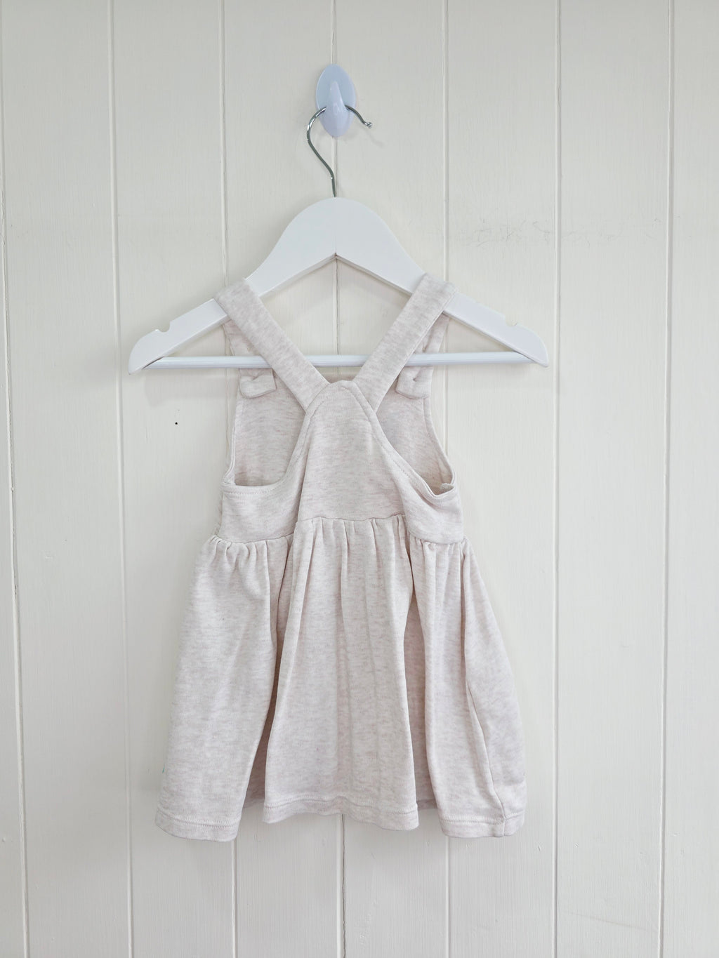 3-3 months pinafore dress features an embroidered "We're Going on a Bear Hunt" design and charming button details