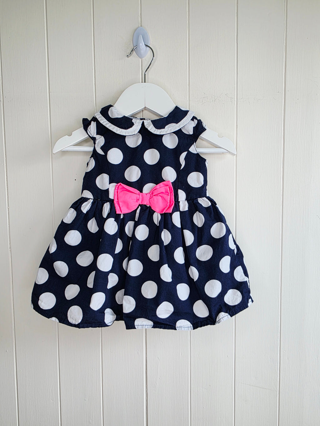 Early days - 3-6 months girls navy blue sleeveless dress featuring giant polka dots and Peter Pan collar