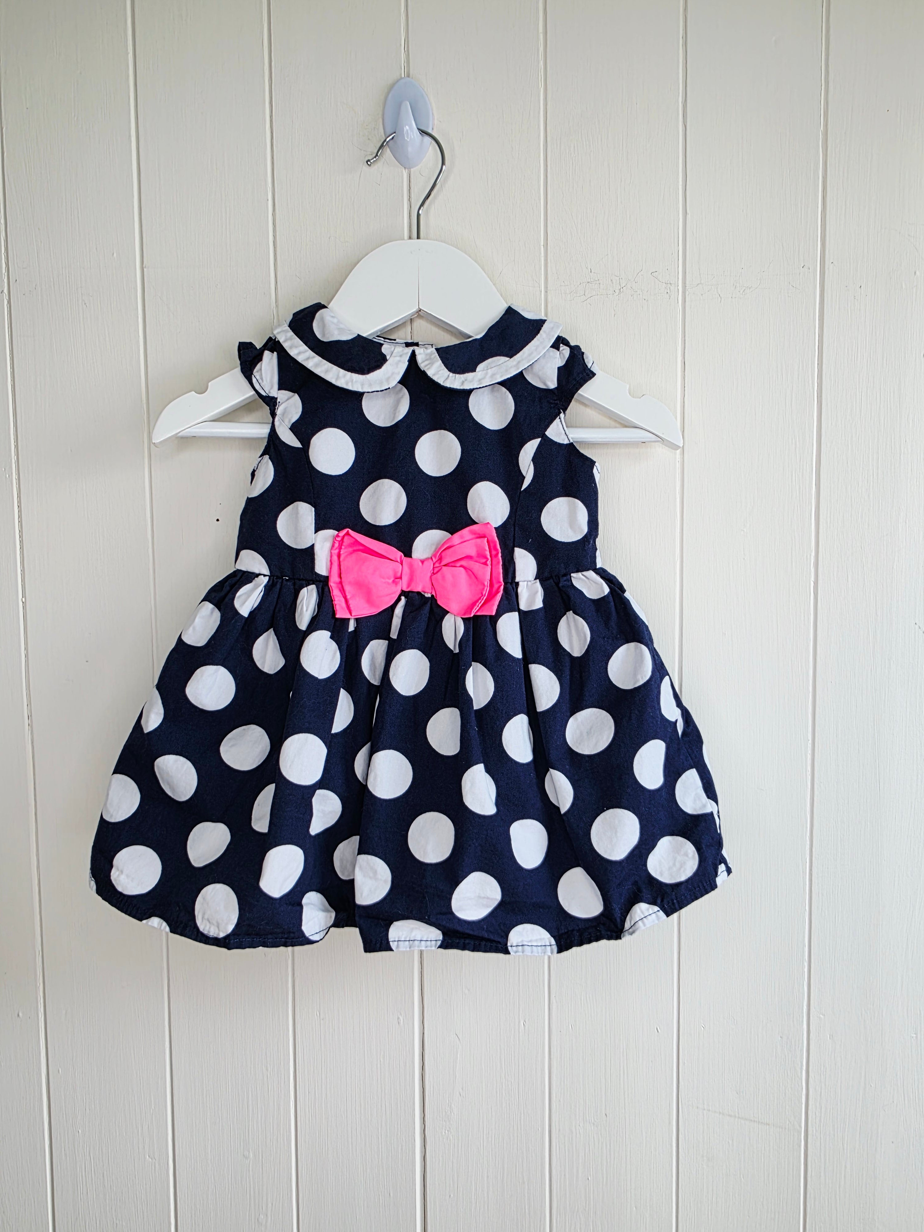 Early days - 3-6 months girls navy blue sleeveless dress featuring giant polka dots and Peter Pan collar
